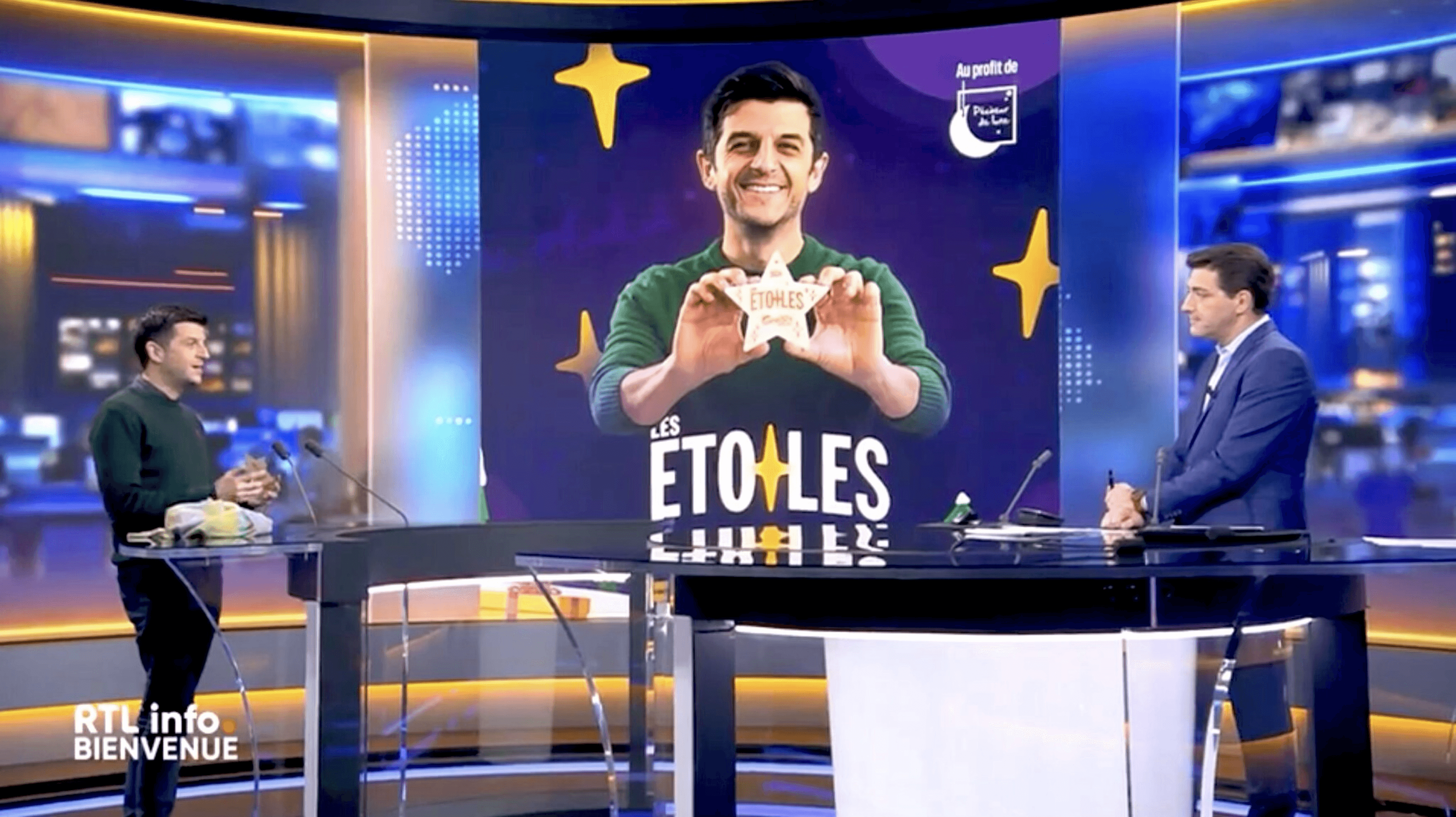 Three slim, upright orange packaging boxes side by side, each showing a partial black smiley face and “Smiley Co” text on the top, with a matching orange background.