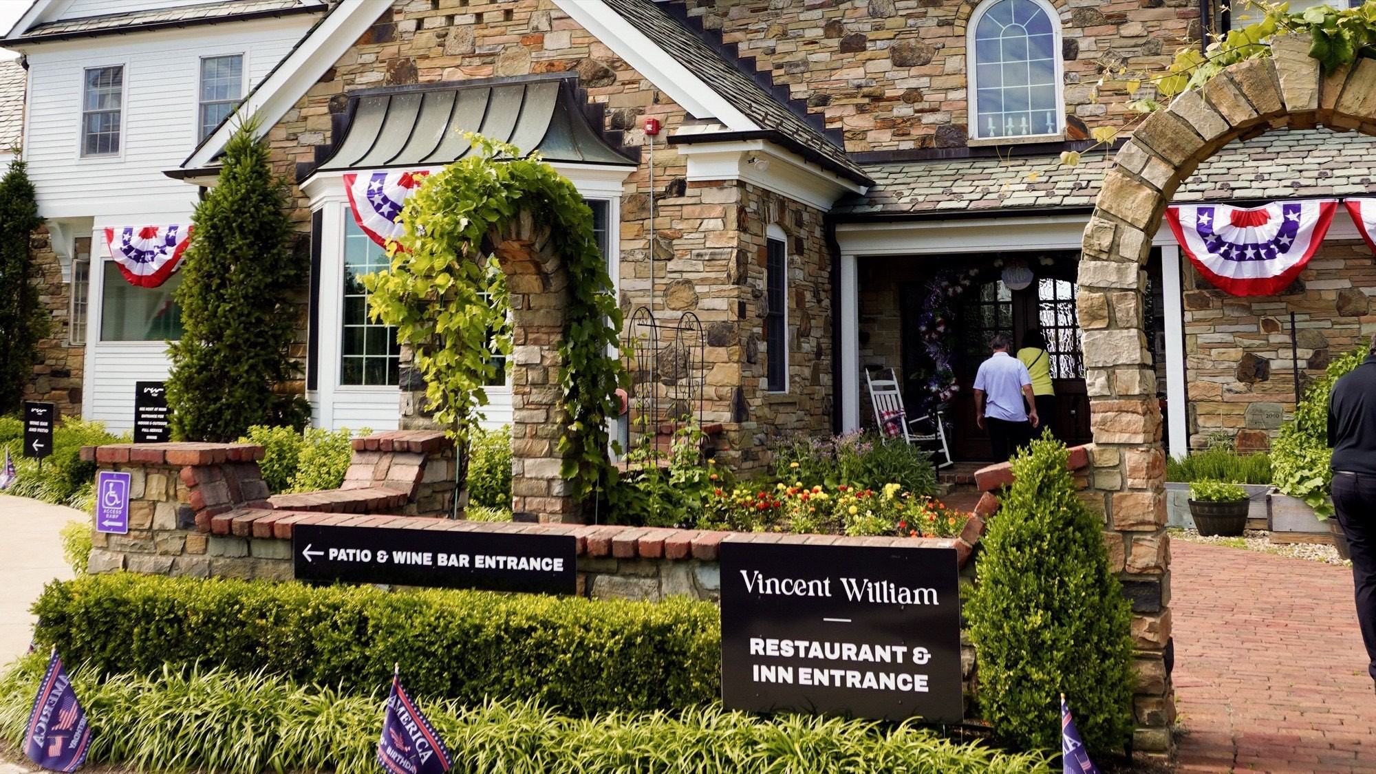 The Vincent William restaurant and inn entrance under summer bunting
