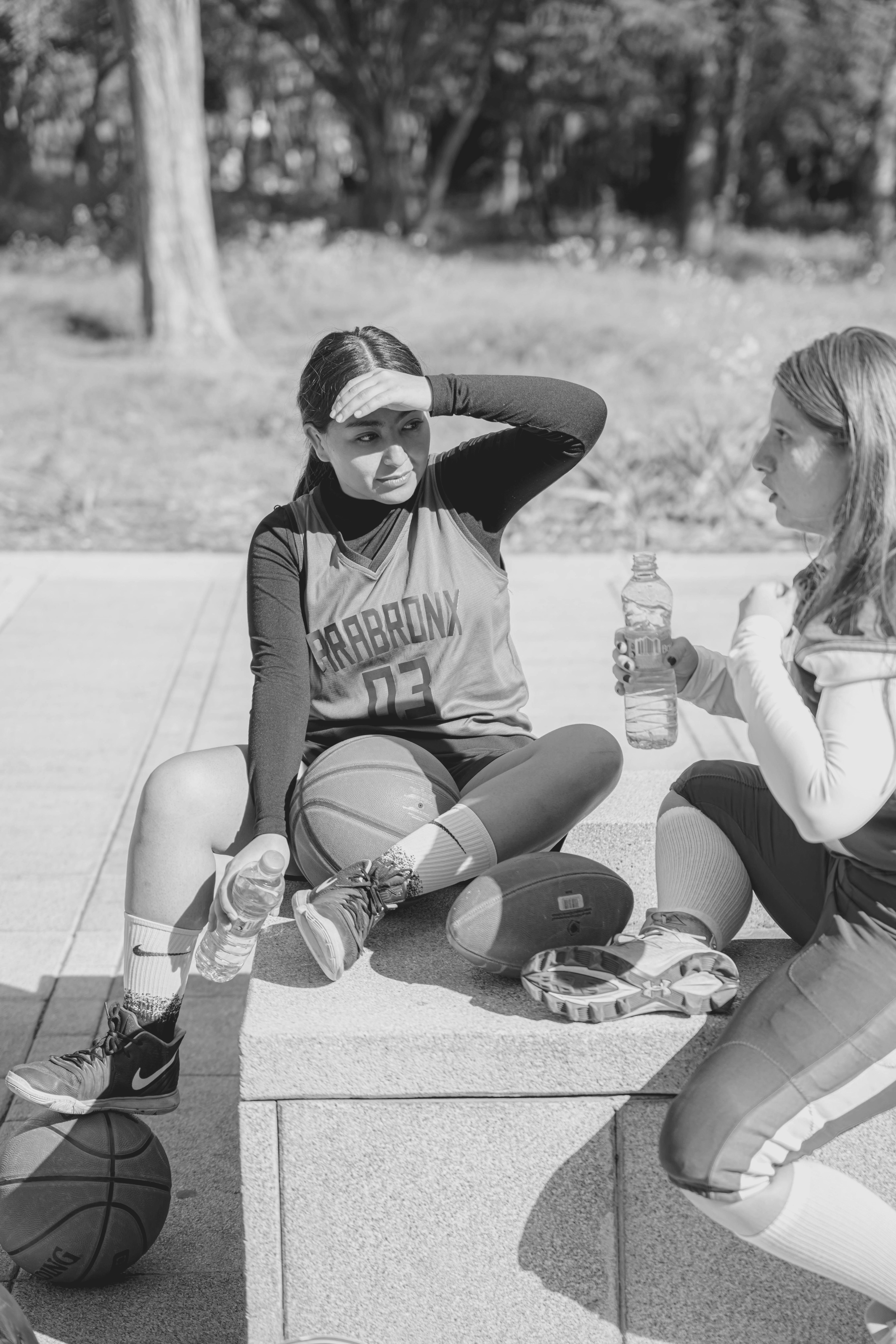 Two women talking in a modern office setting