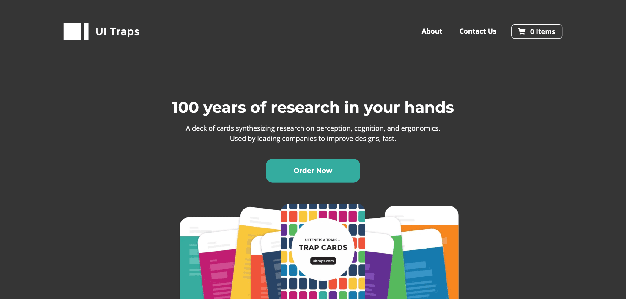 Screenshot of the UI Traps website showing a tagline “100 years of research in your hands” and an image of colorful UX research cards