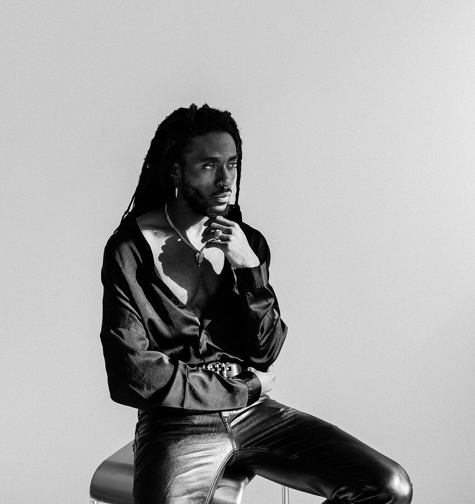 Stoic man sitting on stool