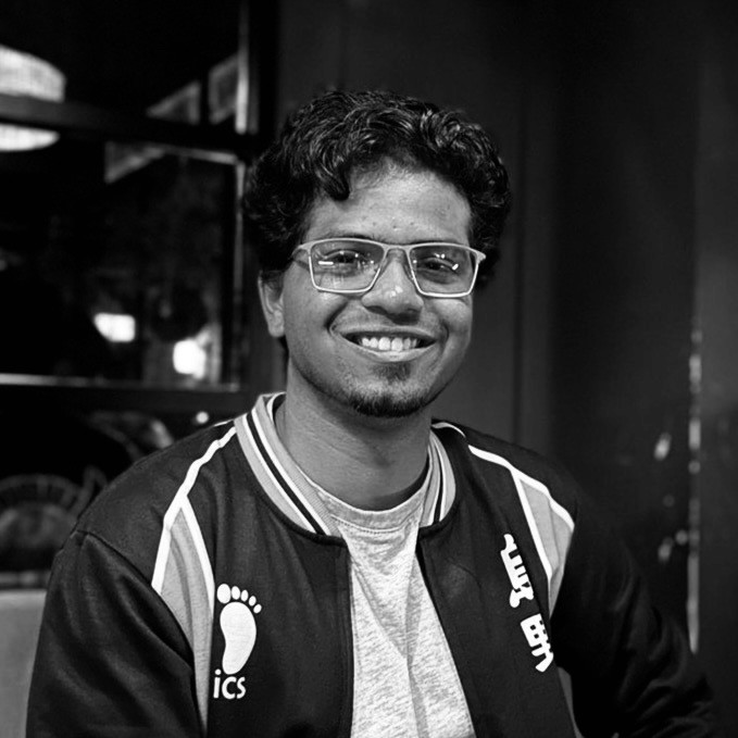 A portrait of a young man smiling