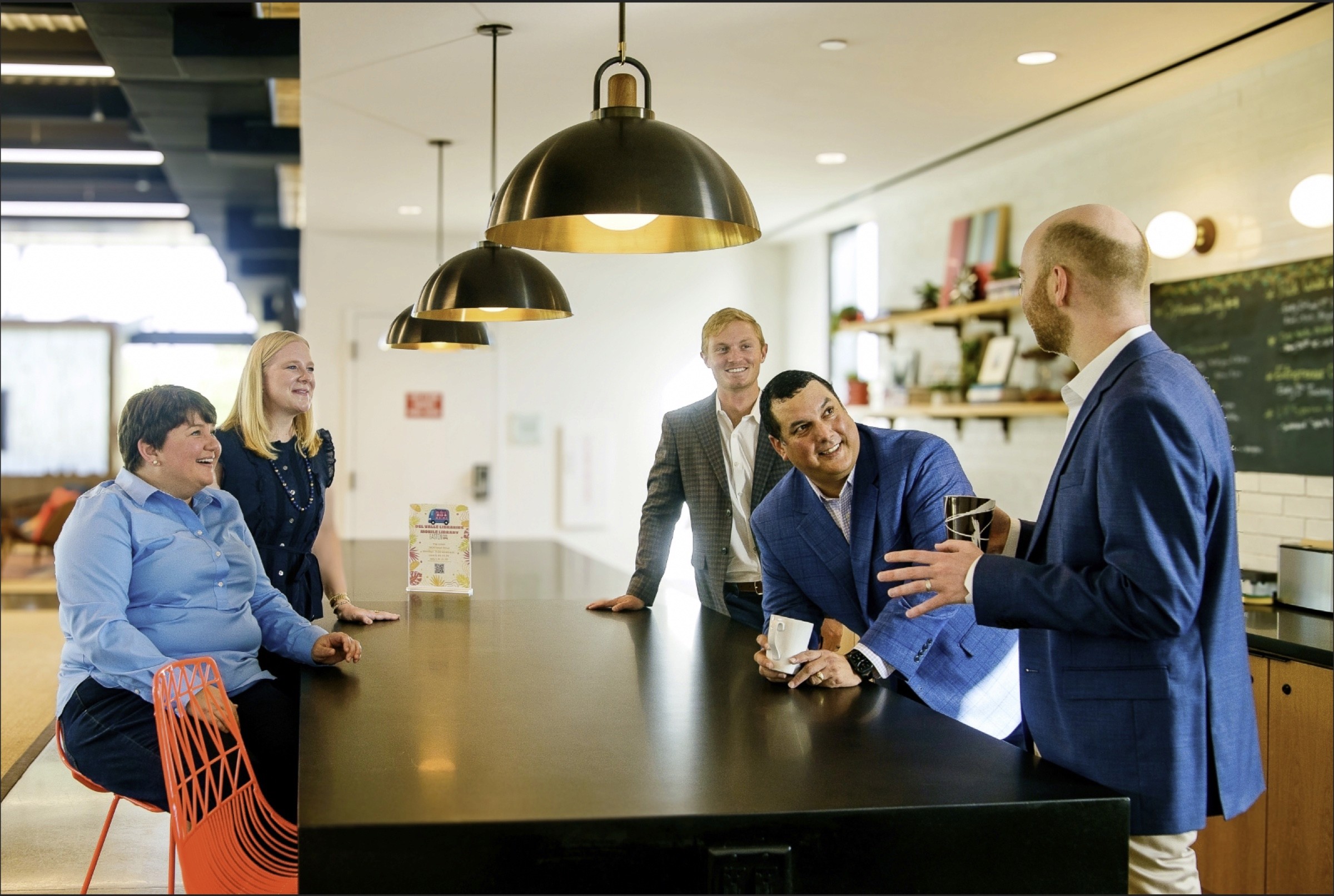 Team members connecting in a workplace kitchen