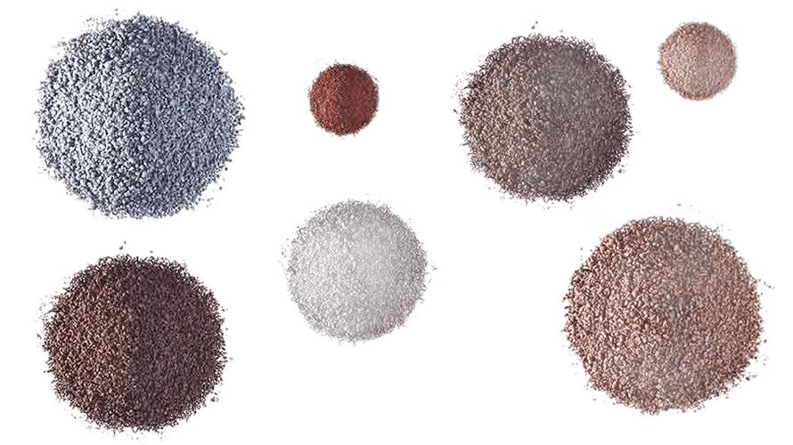Decorative image showing various colored powders in heaps - view from the top down on a transparent background.