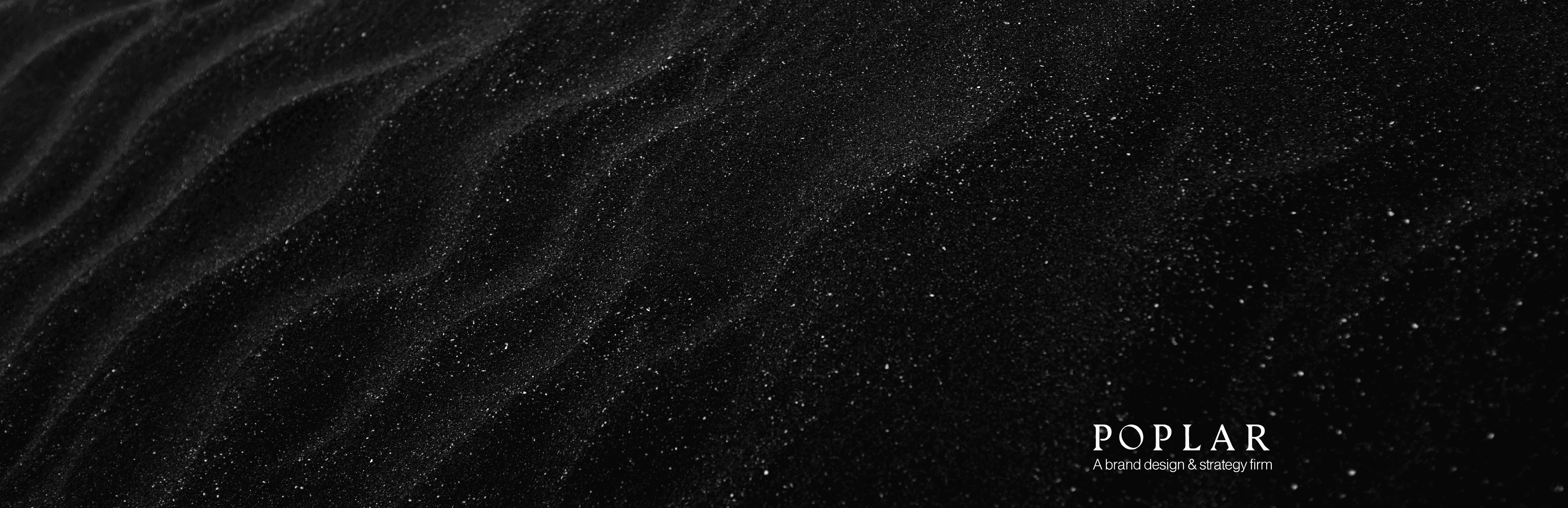  Collaborative work session overhead view of six people collaborating at a rustic wooden table with coffee, papers, and a laptop