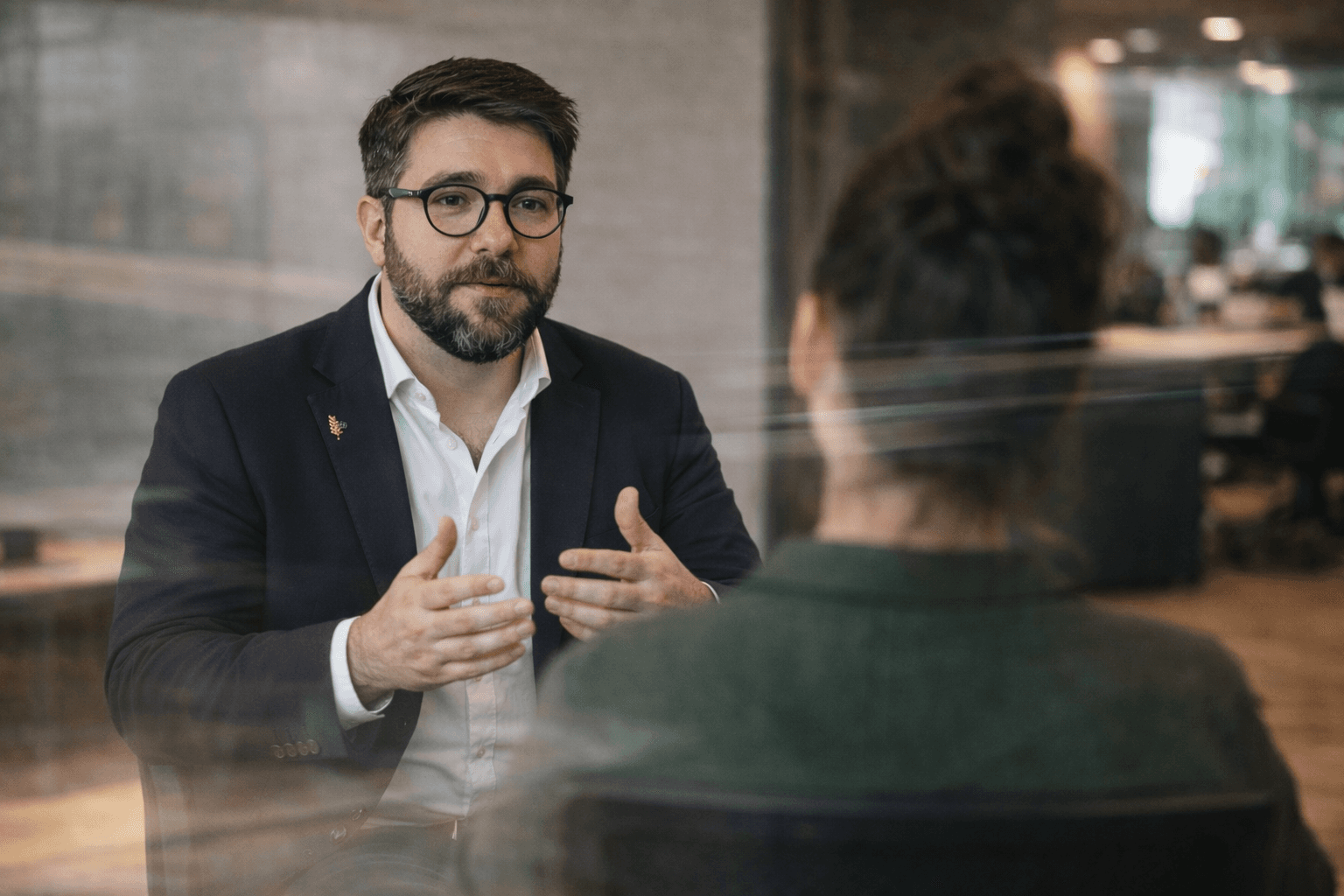 man sitting beside woman looking at a contract on DocuSign
