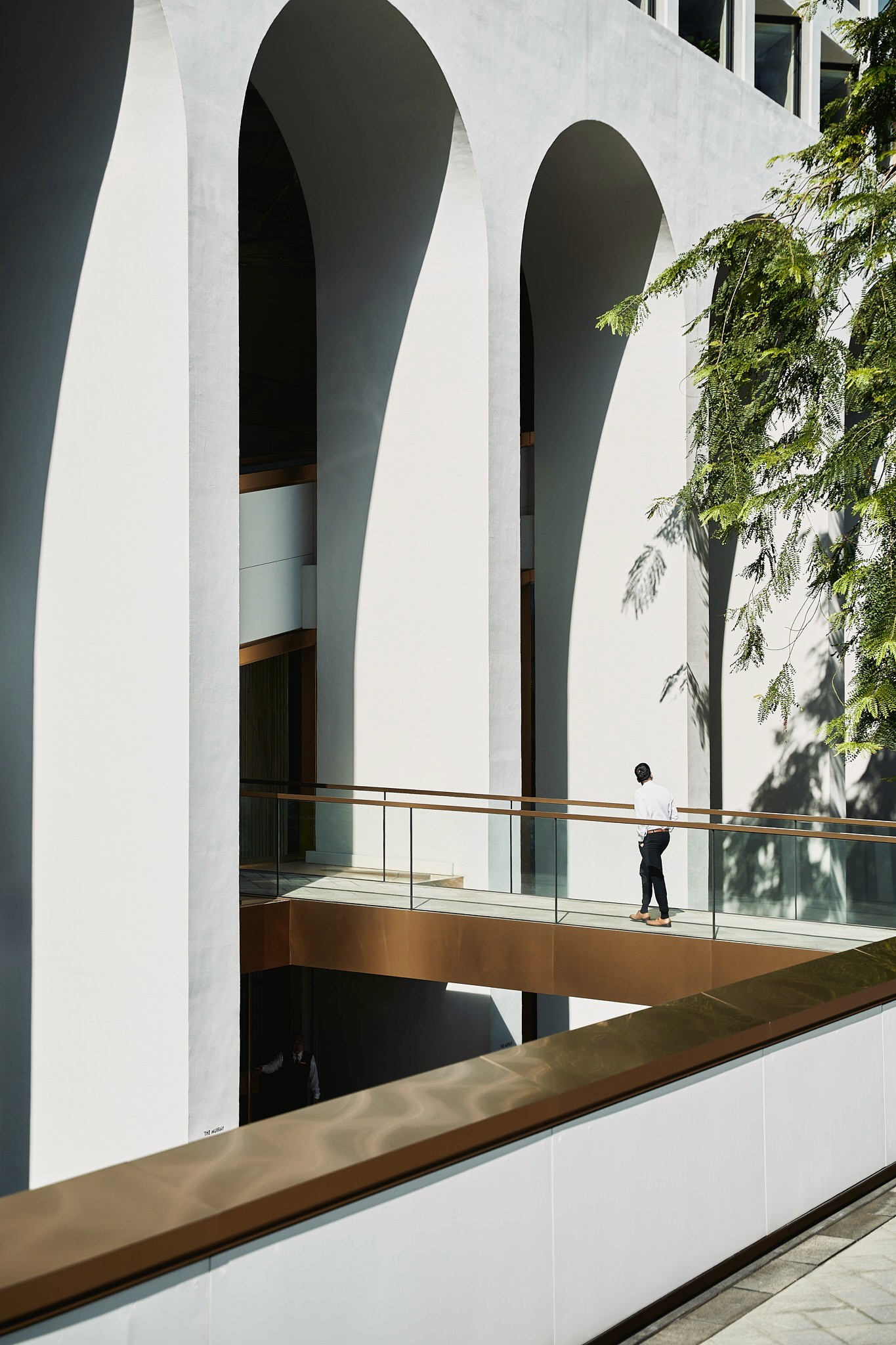 Editorial style view over the shoulder of the ceramist working on the potters wheel.
