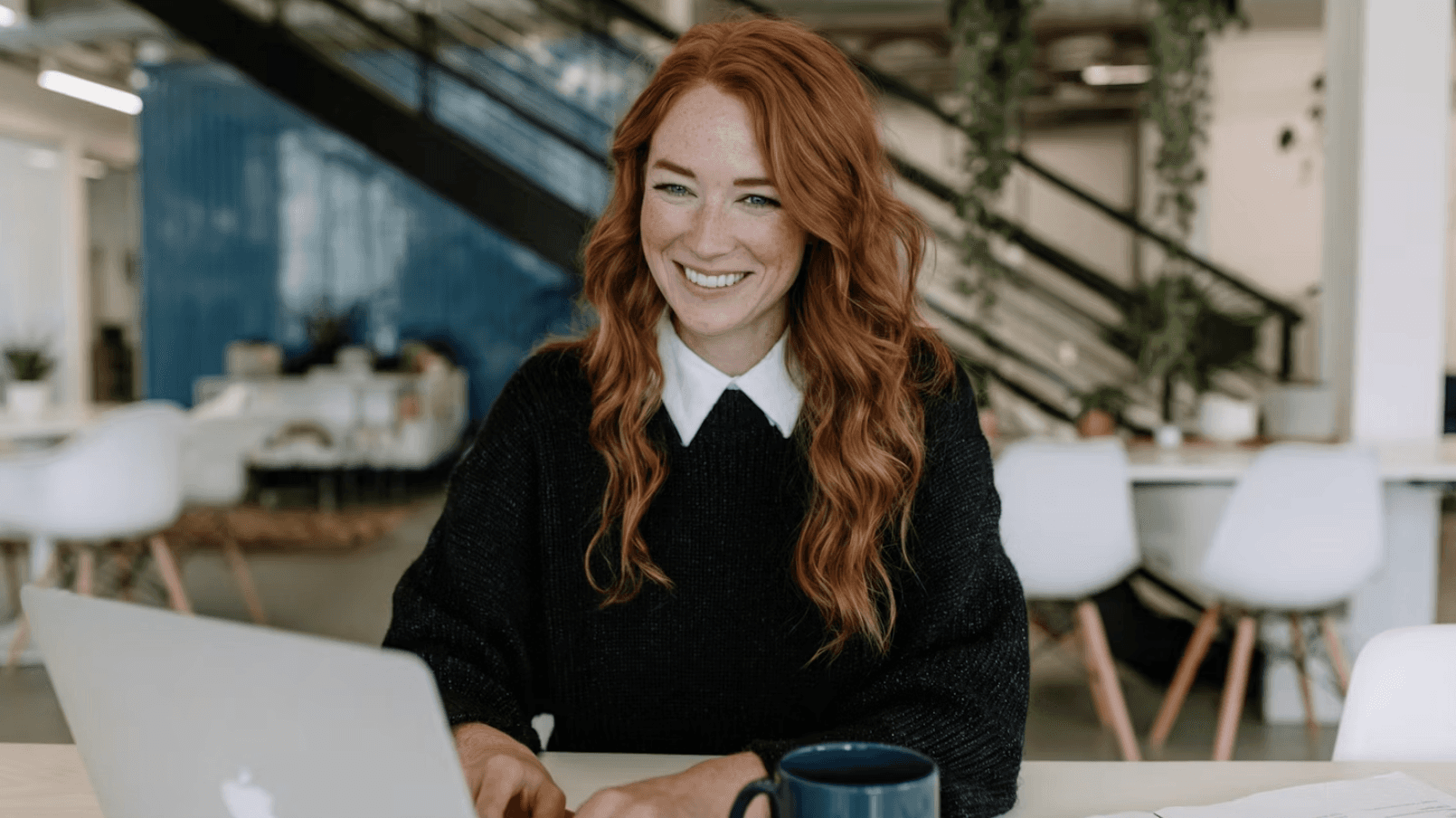 girl using laptop and drinking coffee