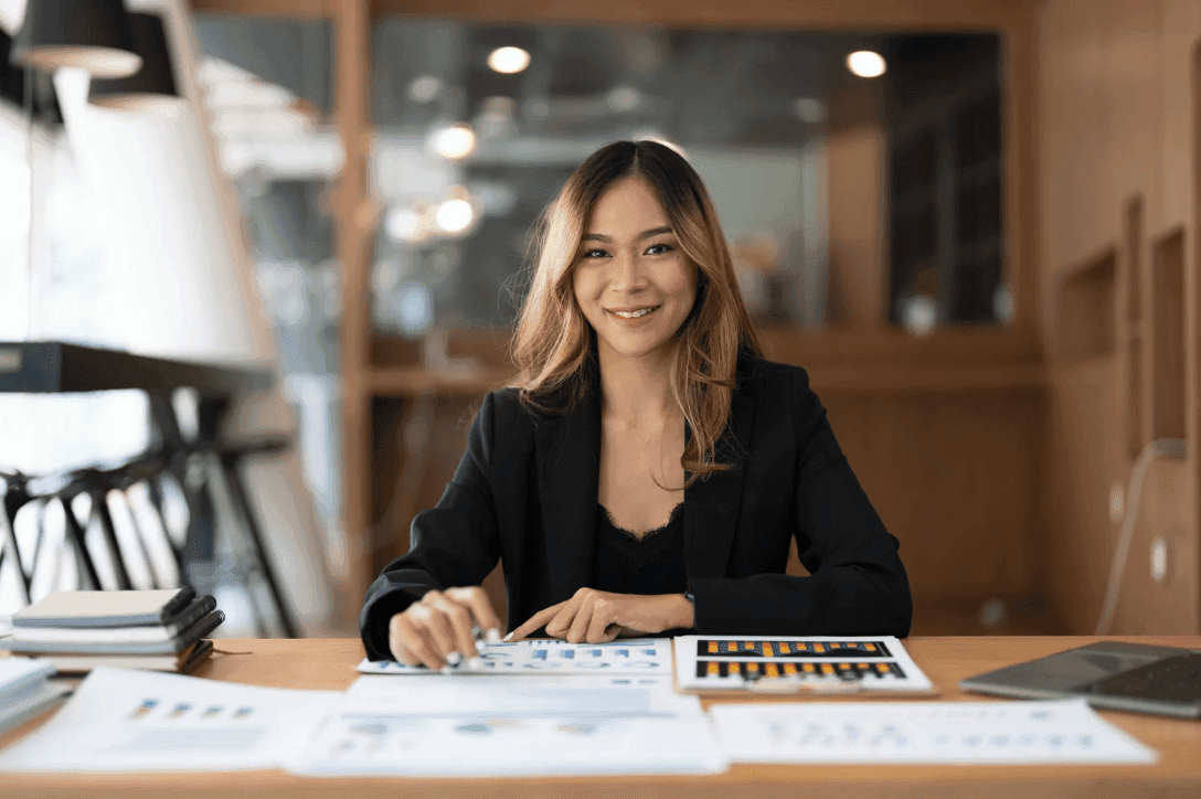 A woman with reports on the table