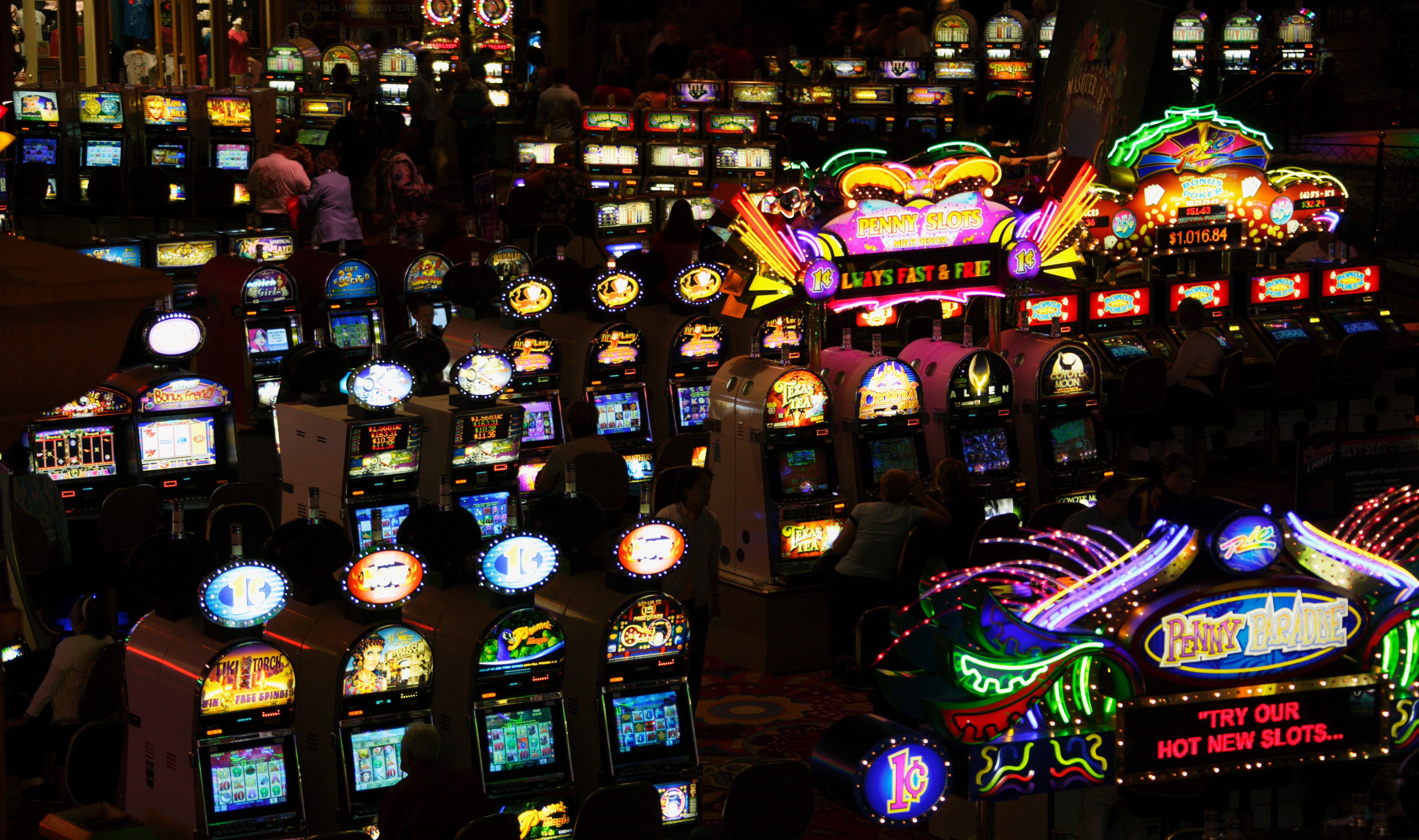 A photo of lots of slot machines in a vegas casino