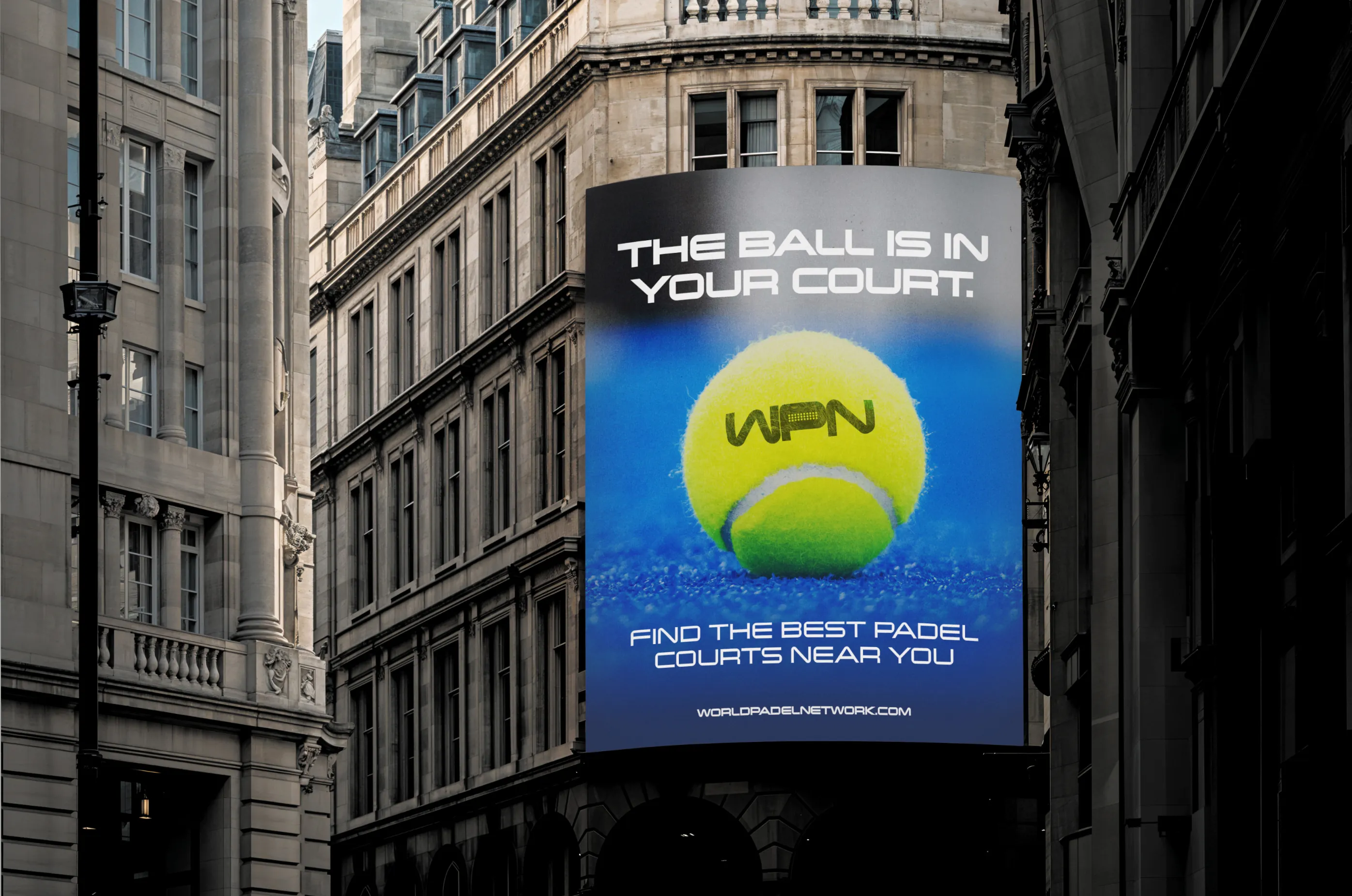 World Padel Network — Street billboard with WPN tennis-ball graphic and headline — Outdoor advertising