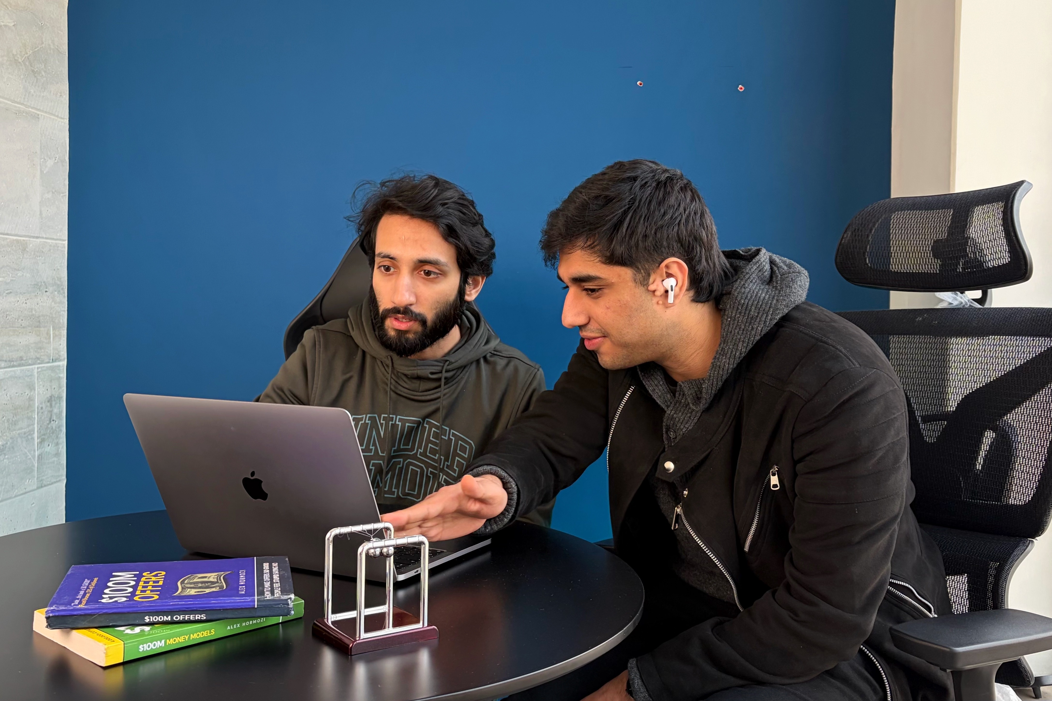 sittin people beside table inside room