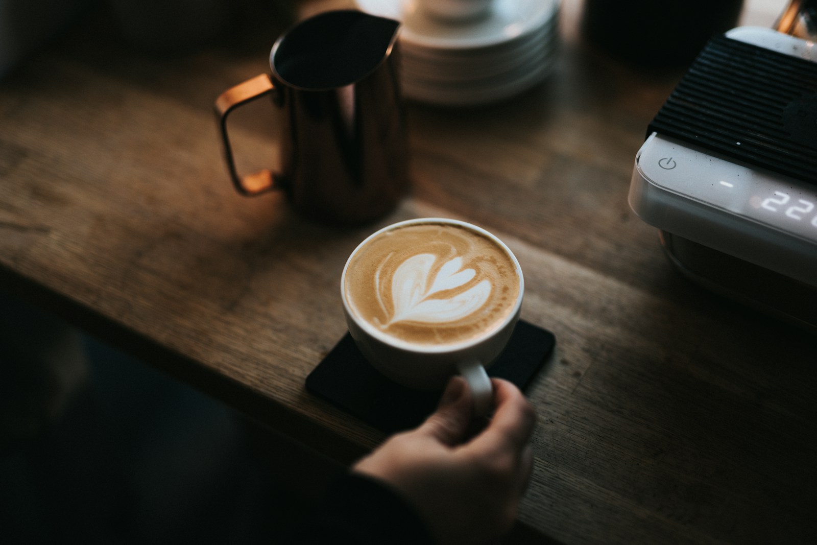 Latte art on a café table at Café de Main