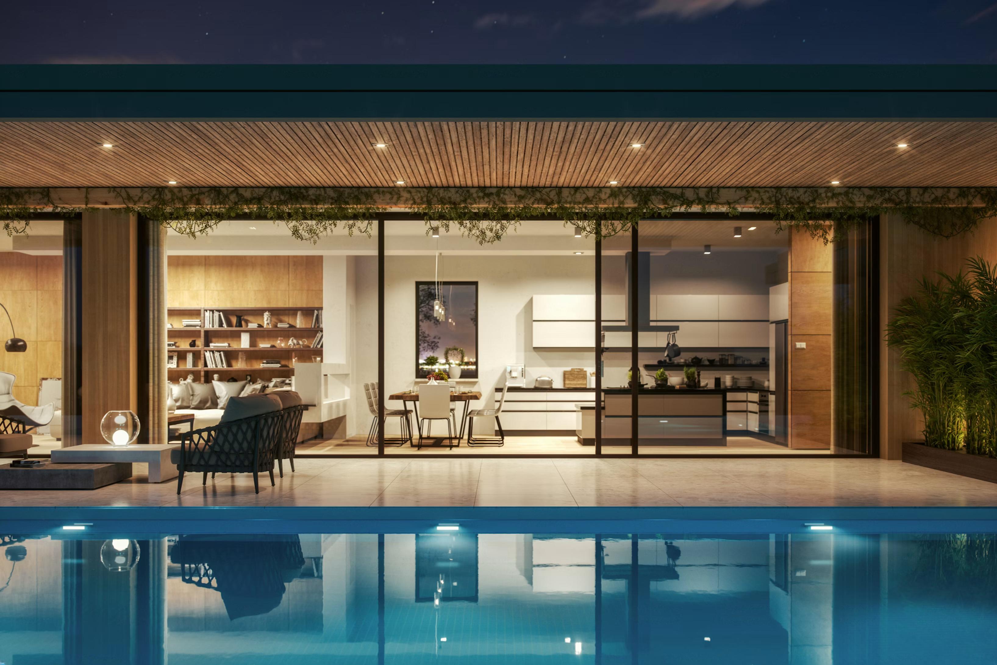 Modern minimalist building by the sea at dusk, with sleek white walls, glowing interior featuring a red chair, and a calm, serene atmosphere.