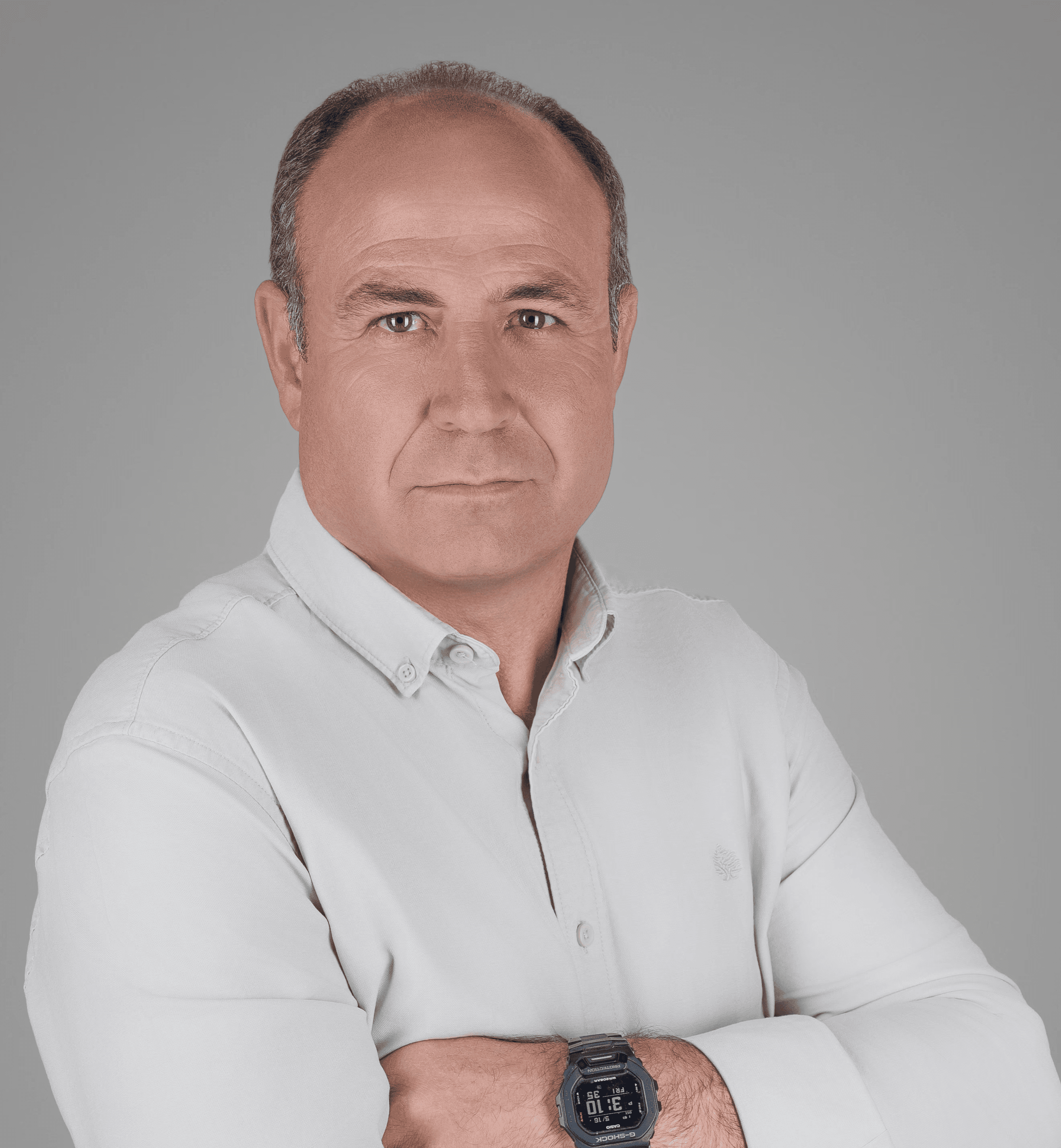 A cozy room with a wooden desk, computer, and warm sunlight streaming through a window.