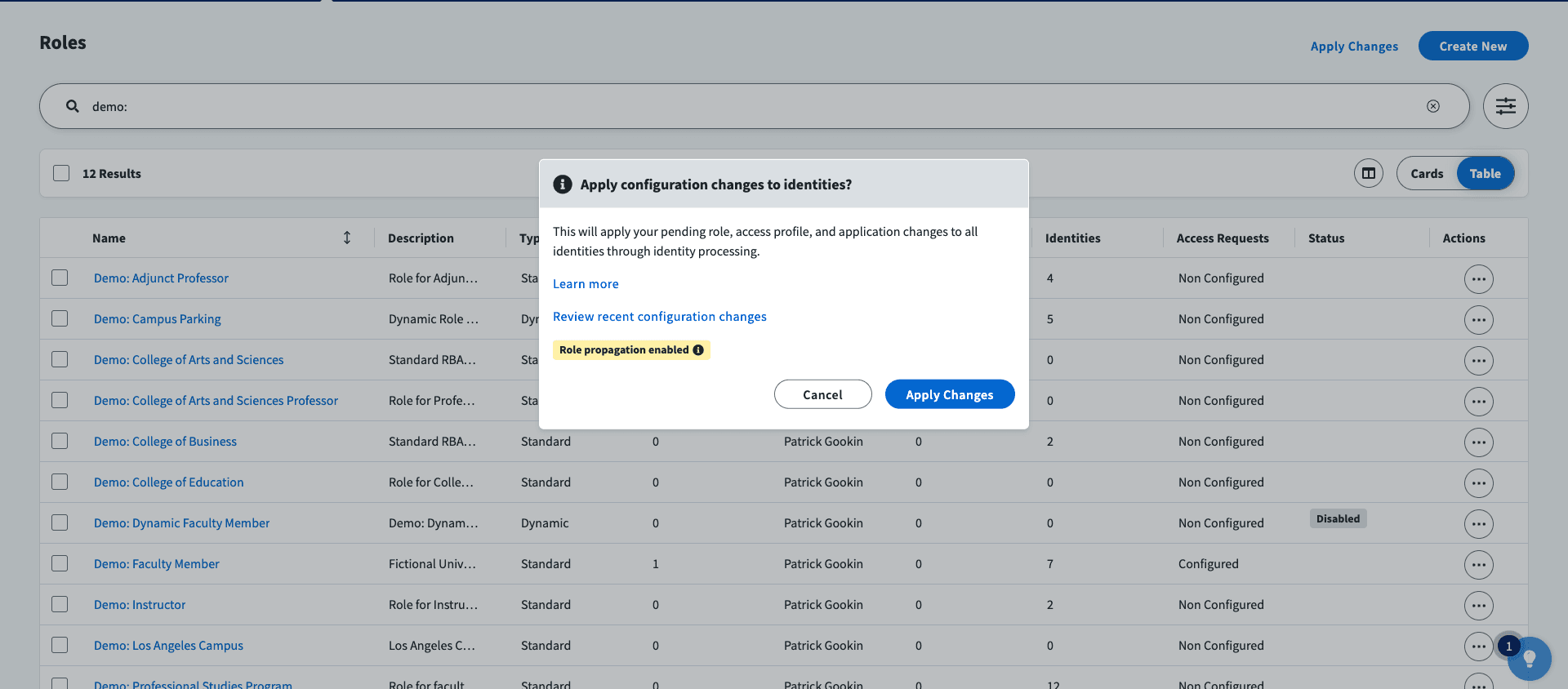 SailPoint ISC 'Roles' management dashboard showing a pop-up confirmation to apply configuration changes to identities with role propagation enabled.