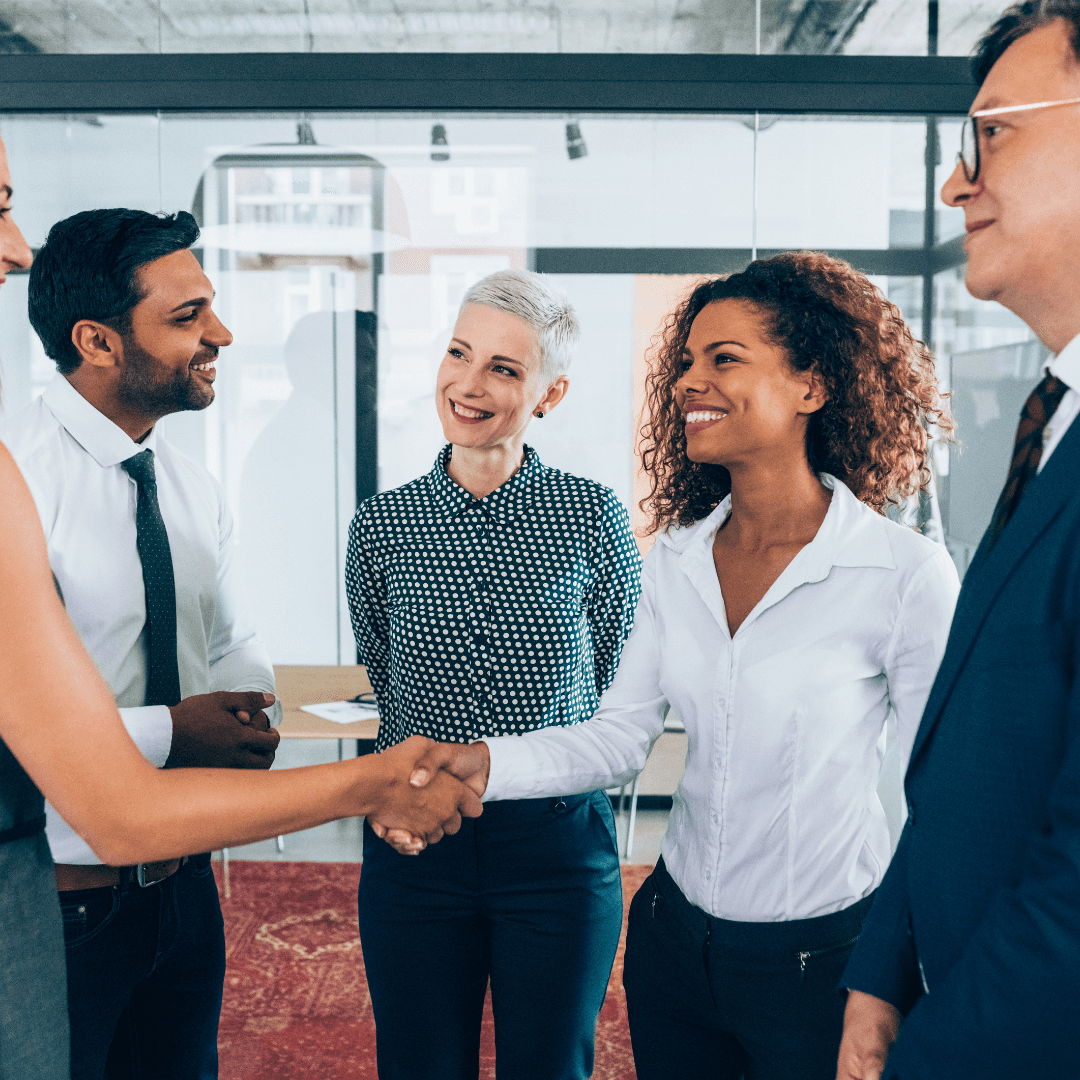 Group of professionals greeting each other