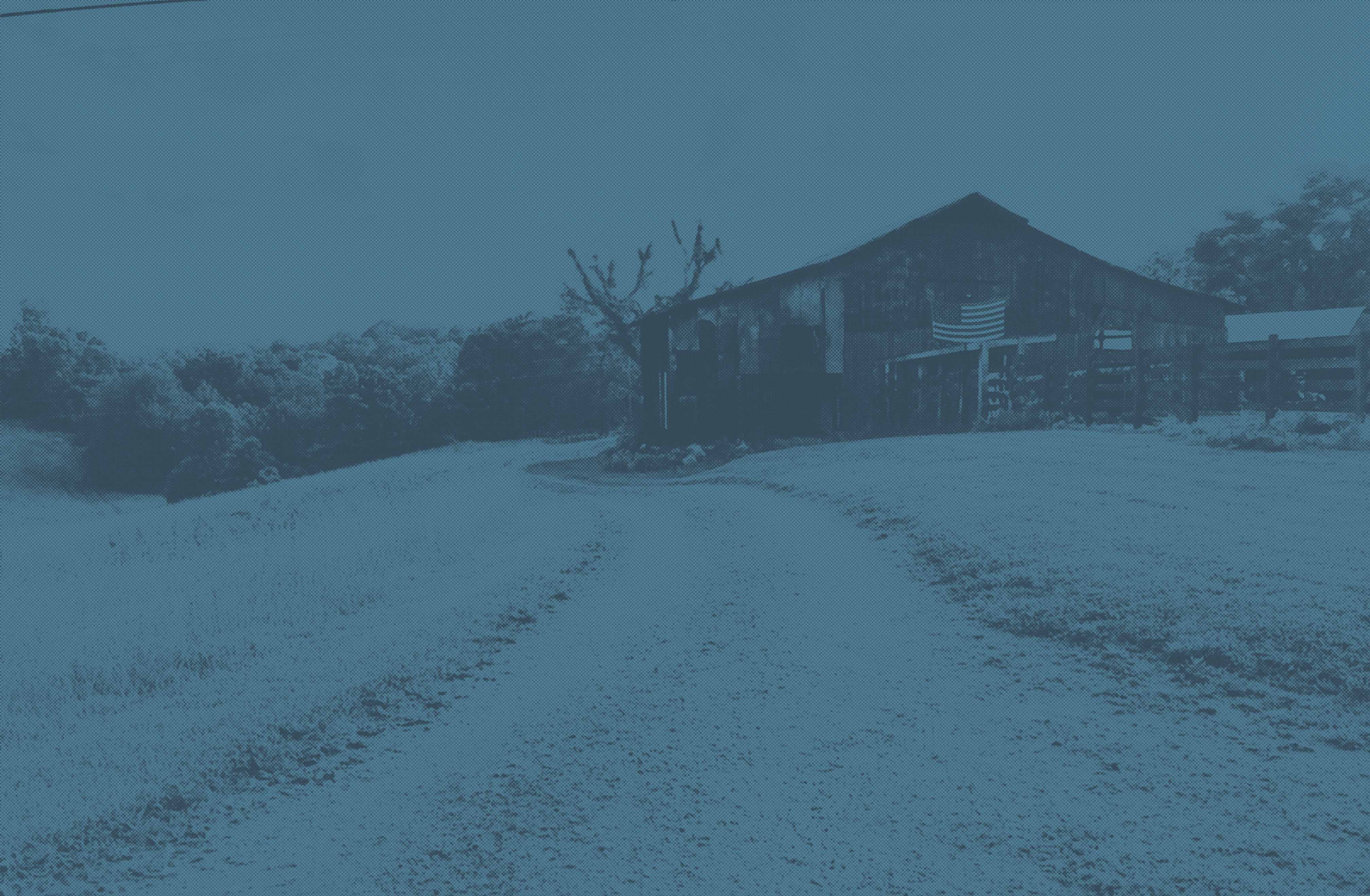 Background image of TN Barn with American Flag