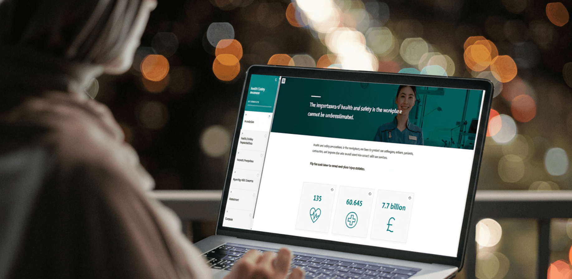 A woman using a laptop to view the Spire Healthcare module. 