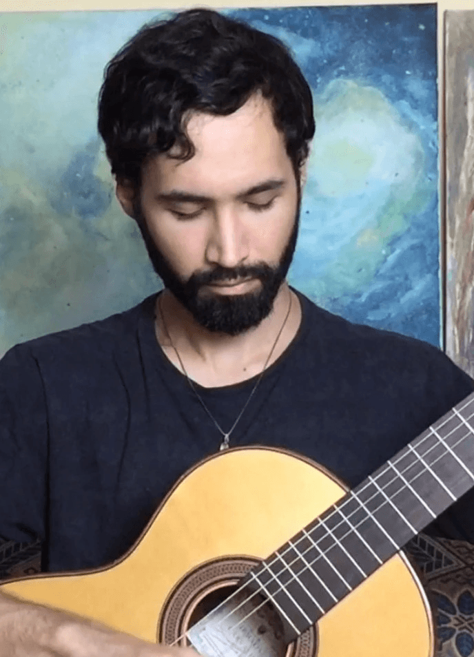 baby playing multicolored xylophone toy