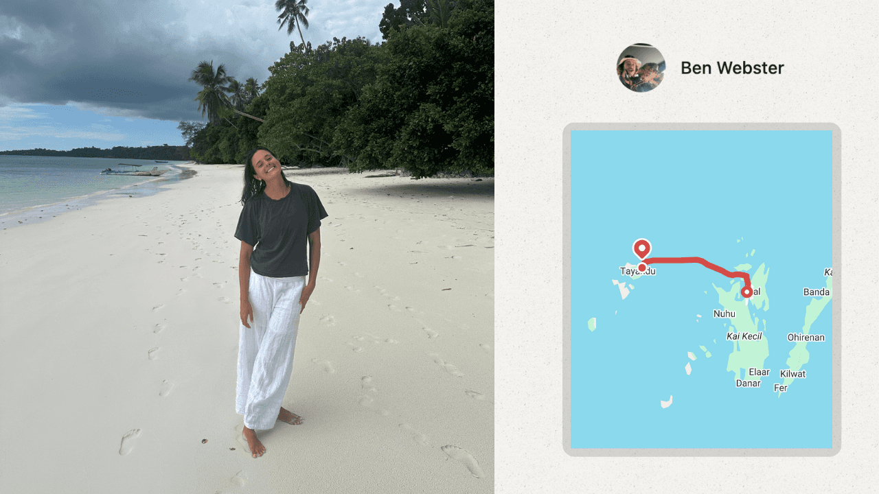 A woman walking on a white sandy beach in Indonesia
