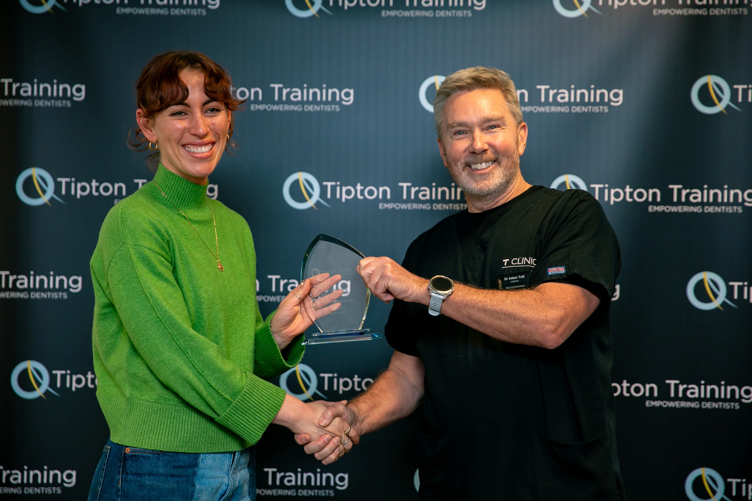 A diverse team collaborates around a table, analyzing documents and charts in a professional setting with a light green background.