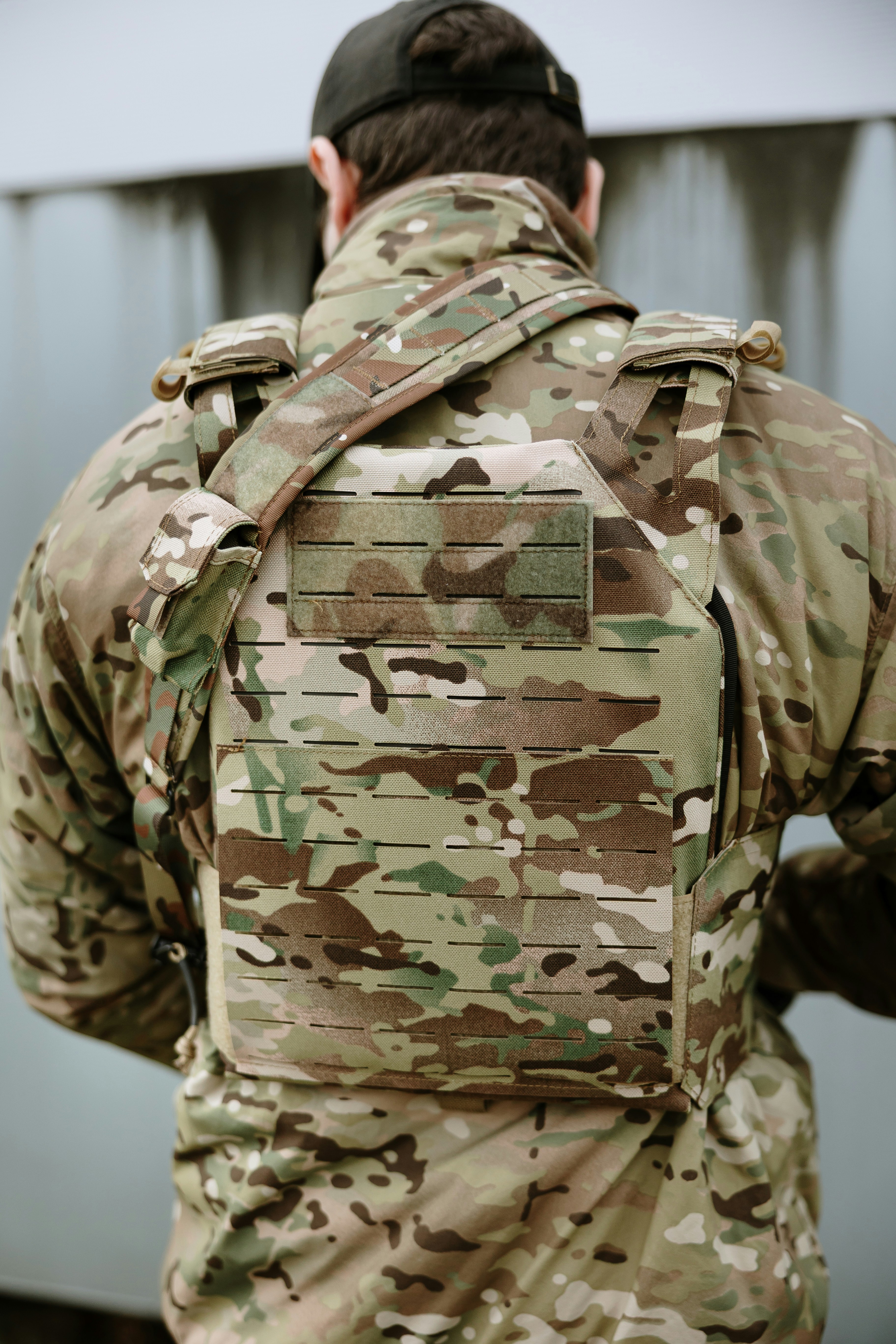 Soldier wearing camouflage tactical vest