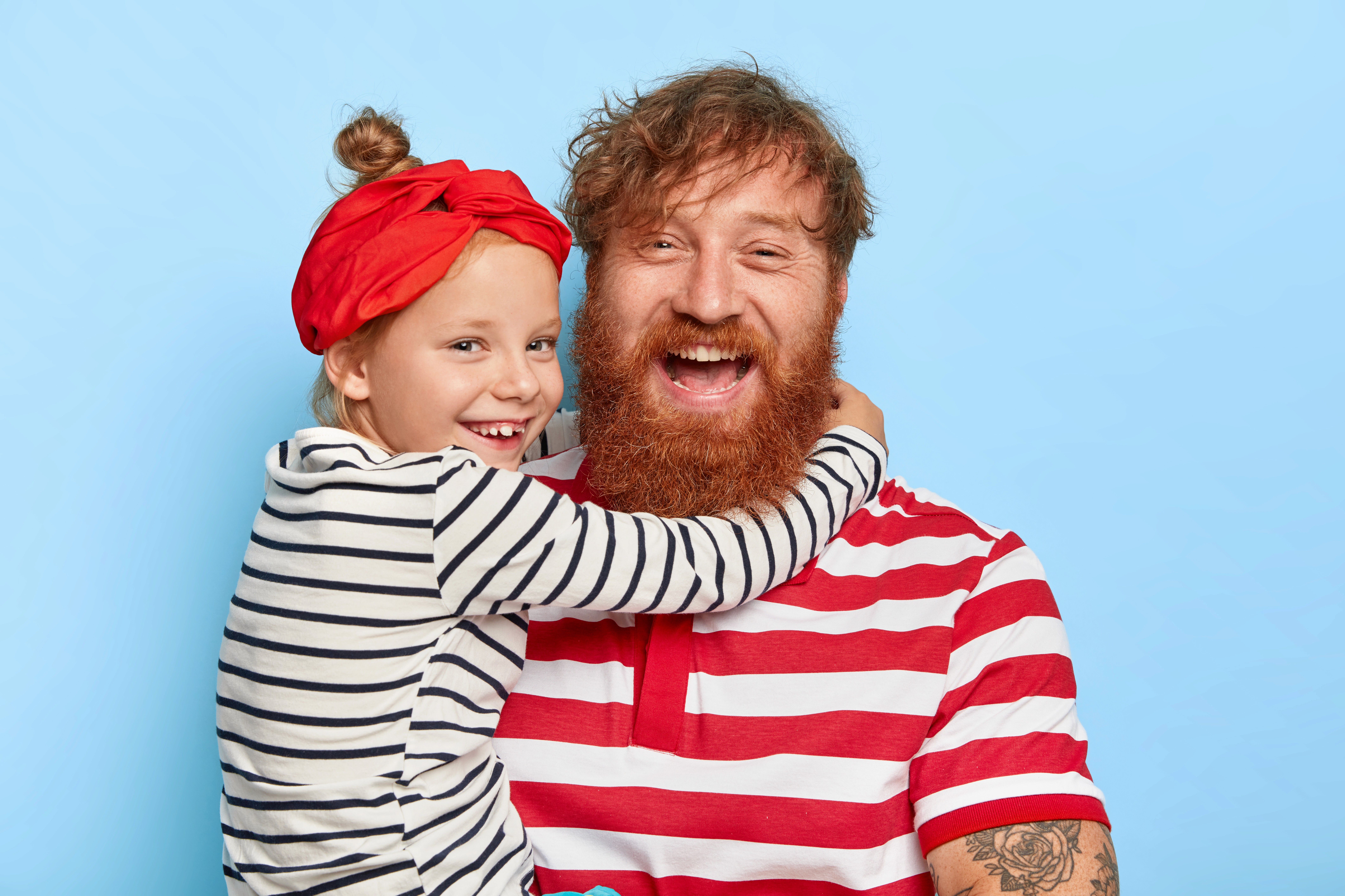 A smiling happy customer with curly hair on a blue background