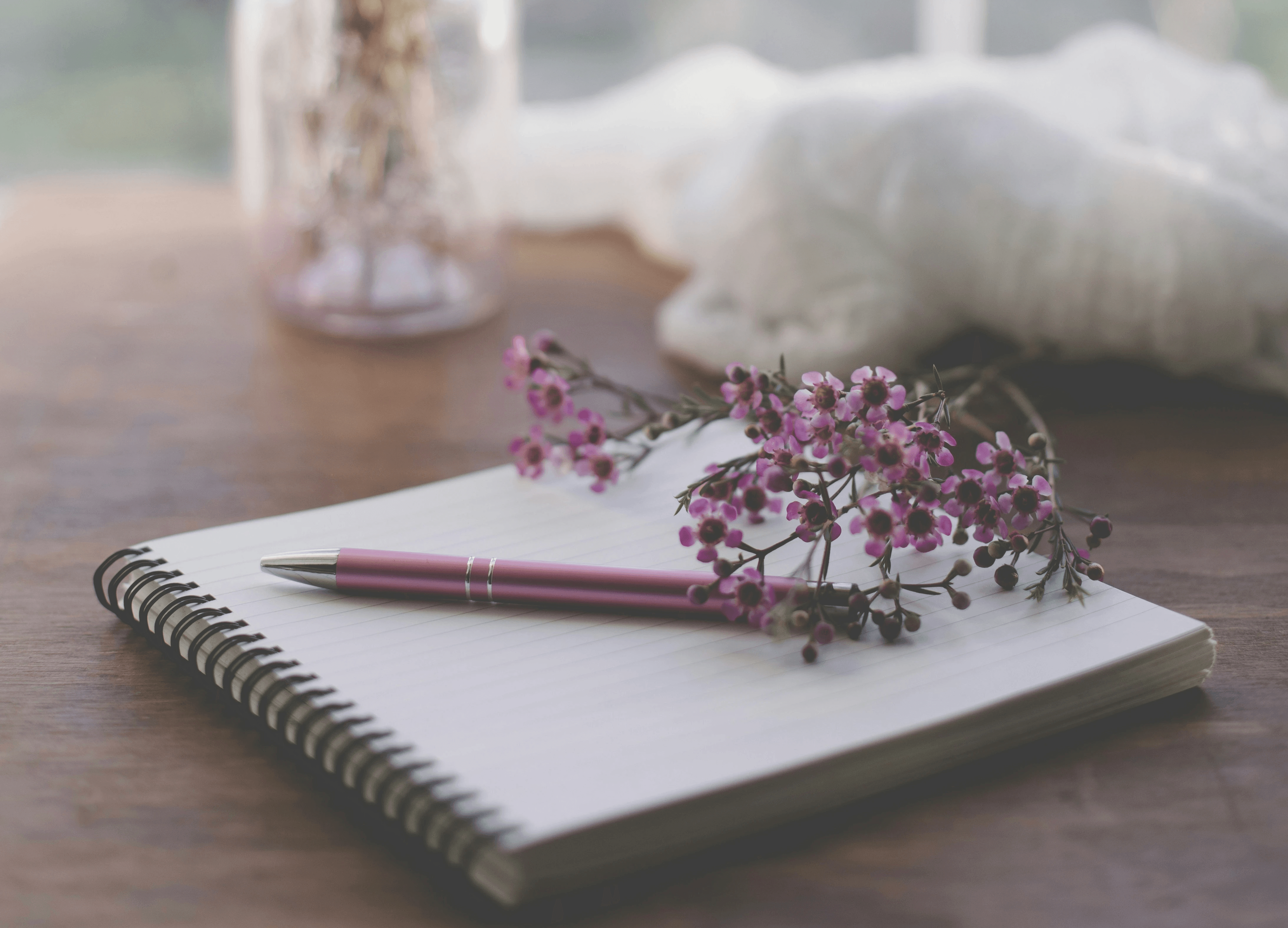 notebook and pen on a desk