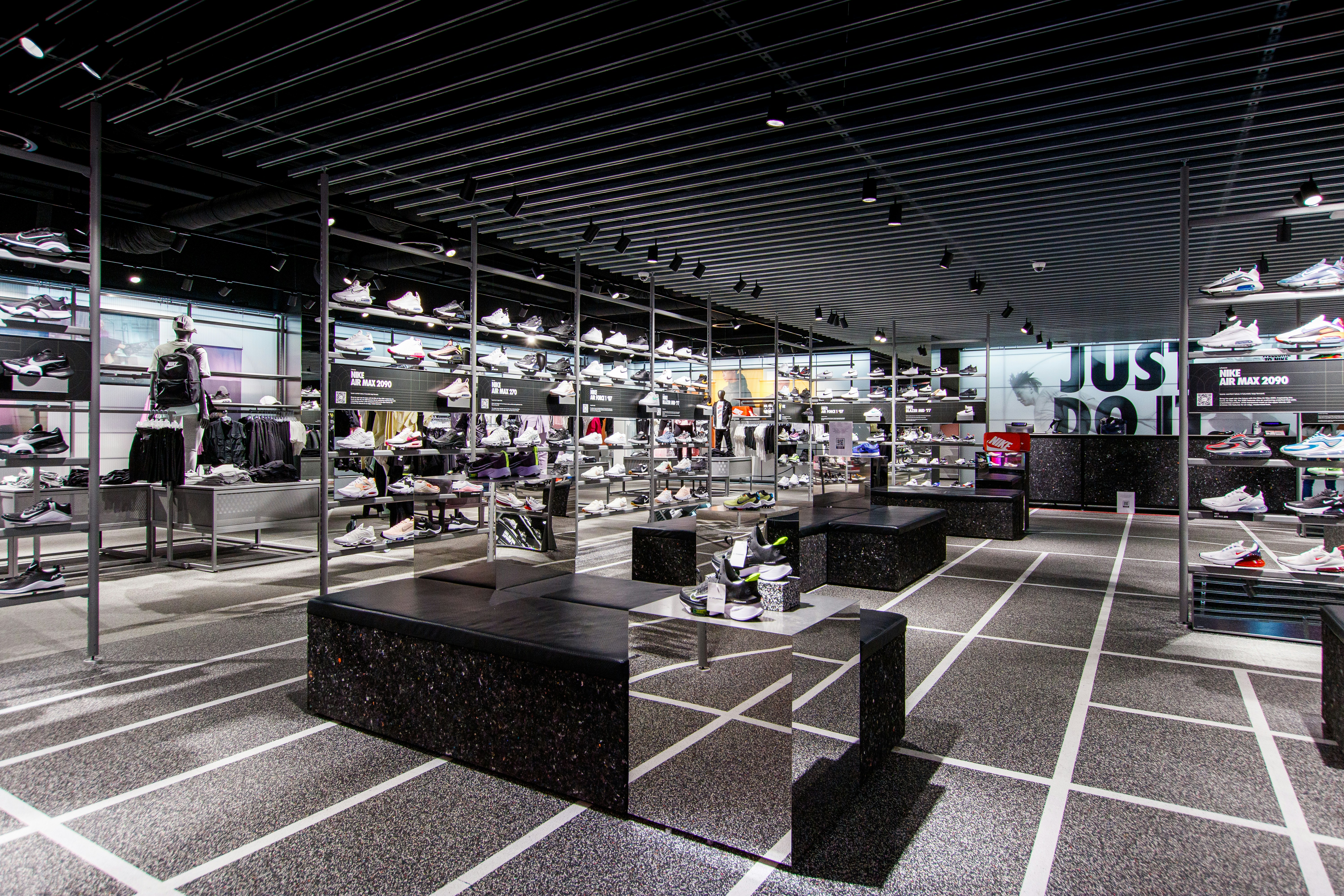 a room filled with lots of black and white shoes