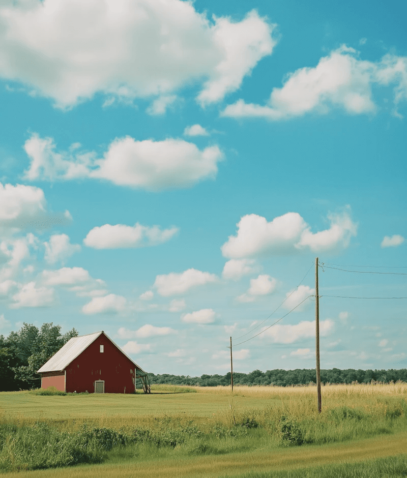 Editorial landscape of clouds and red barn