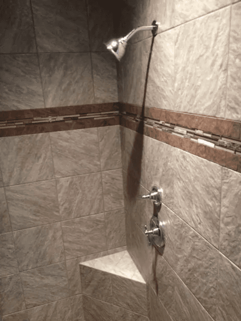 Elegant shower tile installation by Shilling's Carpets & Floors