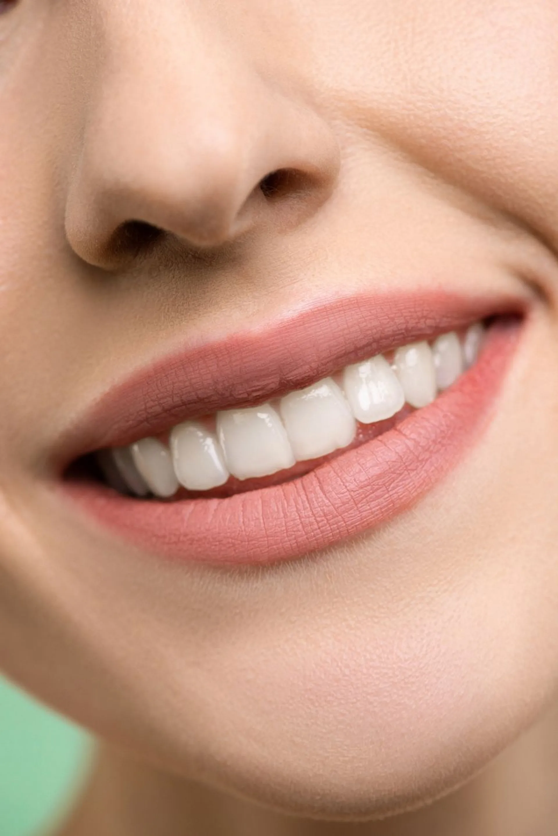 a young white woman smiling showing teeth