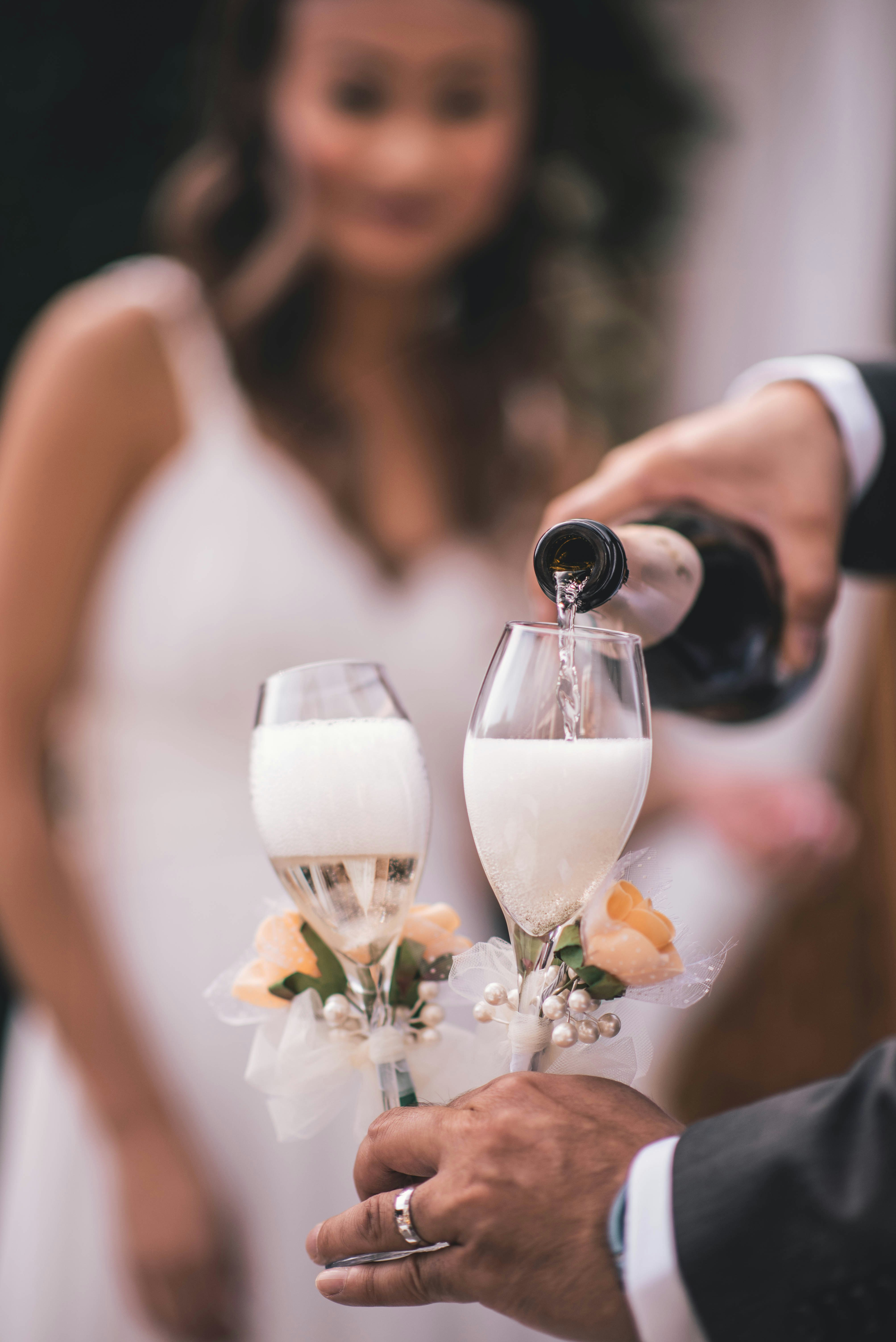 a couple of people that are holding wine glasses