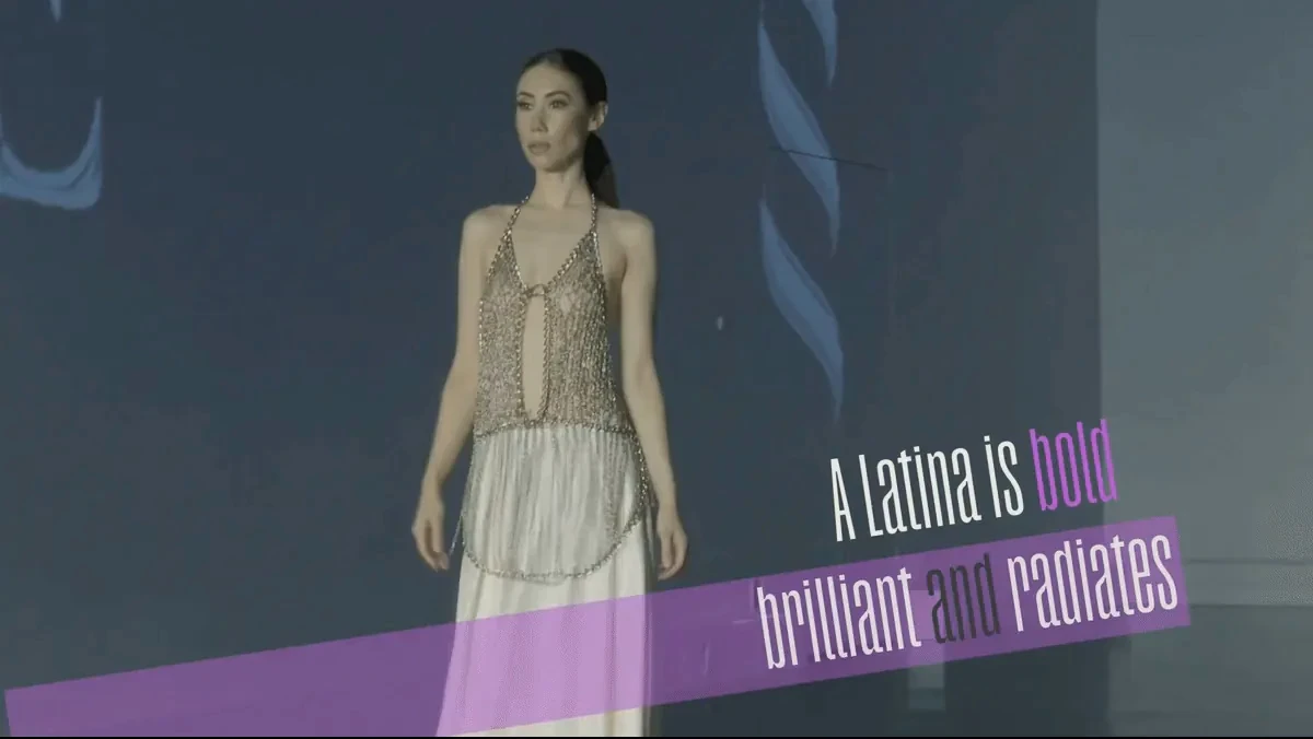 Latinas snippet - Model walking with text "A latina is bold, brilliant and radiates"