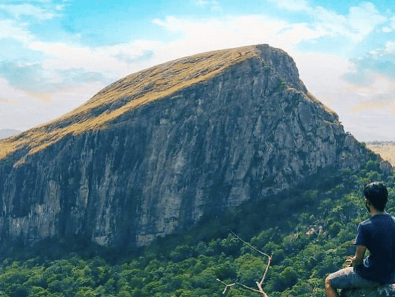 a group of women standing on top of a sandy beach