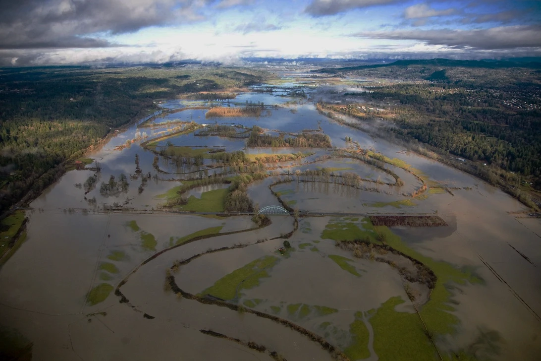 An aerial image of a flooded riverbank.