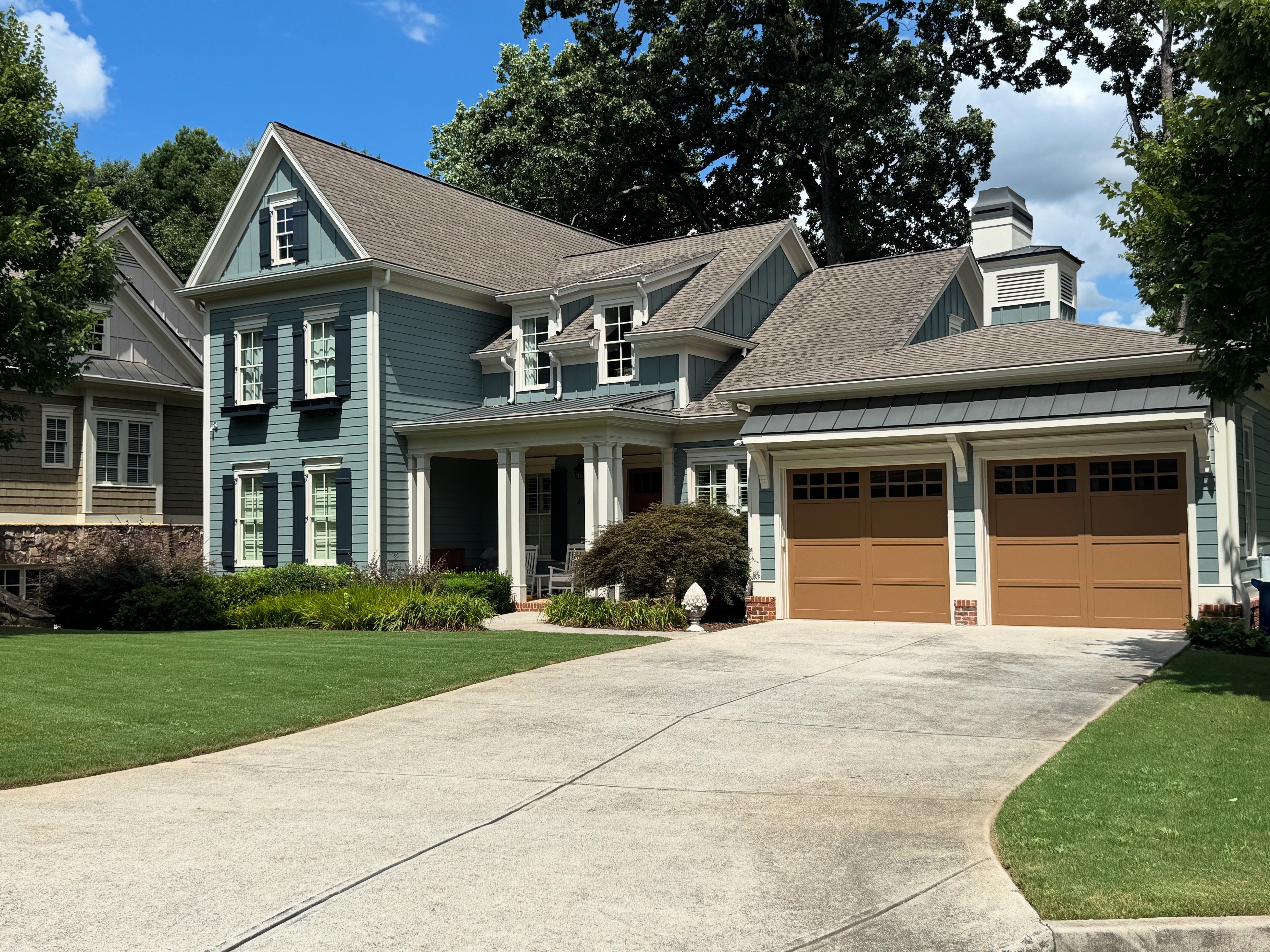 trees beside white house
