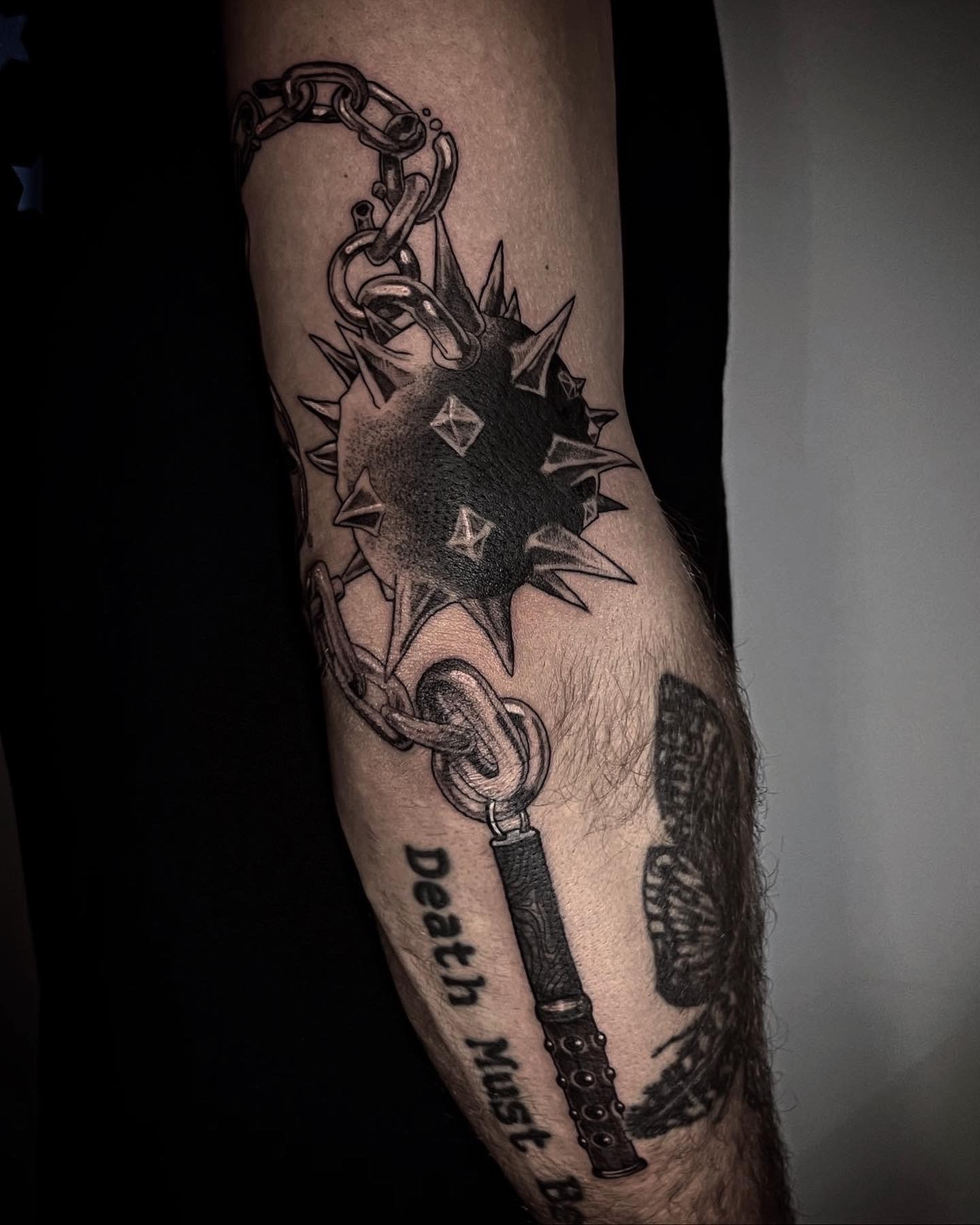 Black and grey tattoo on a leg depicting Alucard and Seras Victoria from the anime series Hellsing.