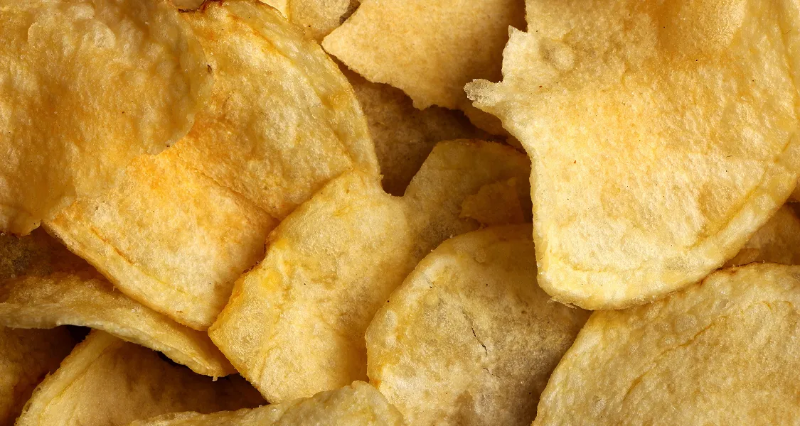 Potato chips representing ultra-processed foods that are often high in refined starches, added sugars, and calories.