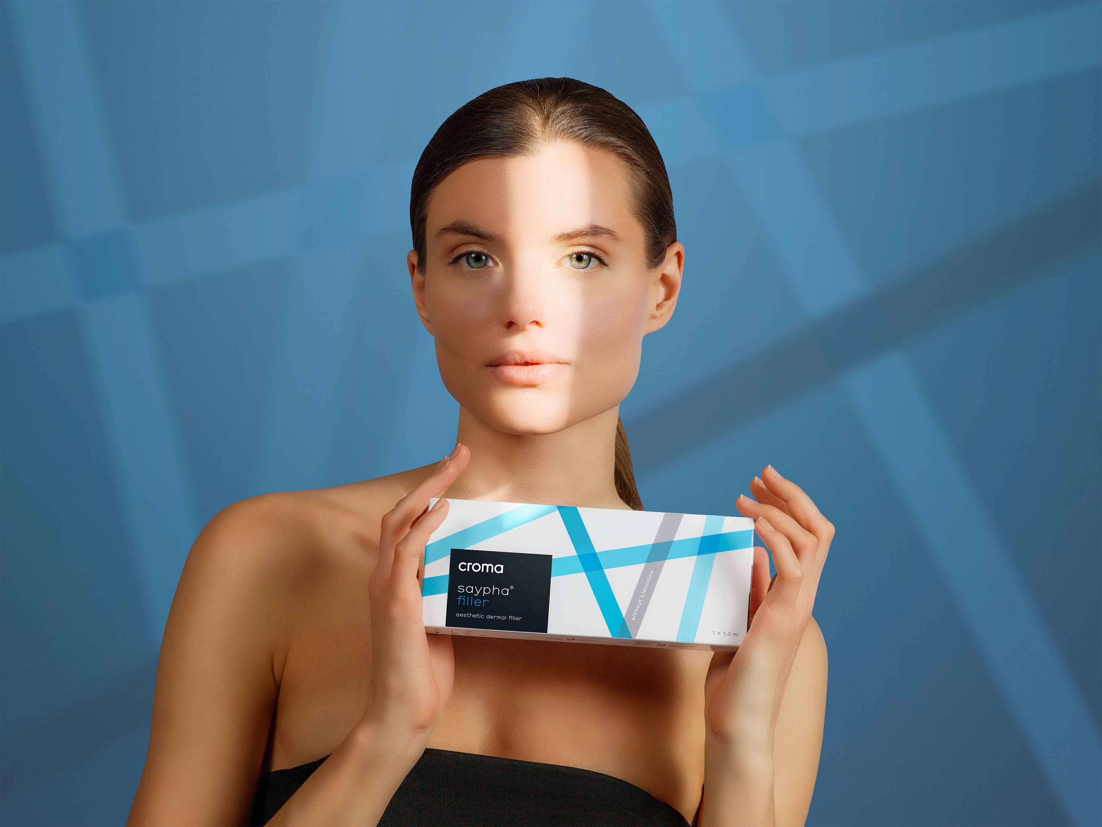 Model holding Croma Saypha Filler hyaluronic acid dermal filler packaging