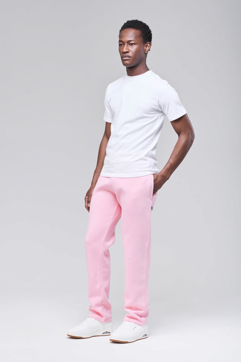Male model wearing pink Langley heavyweight sweatpants, full figure