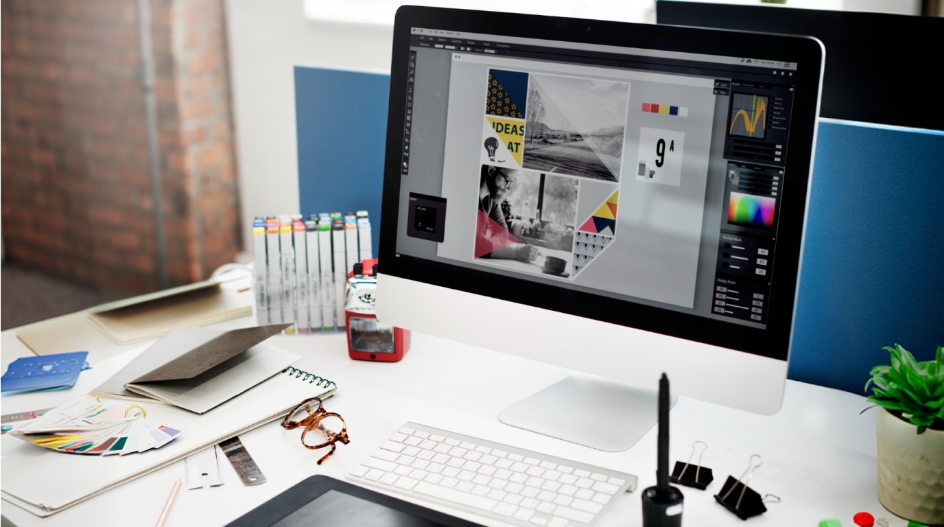 How to choose a branding agency — designer's desk with mood board, colour swatches, and design tools on screen — Penguincil Design