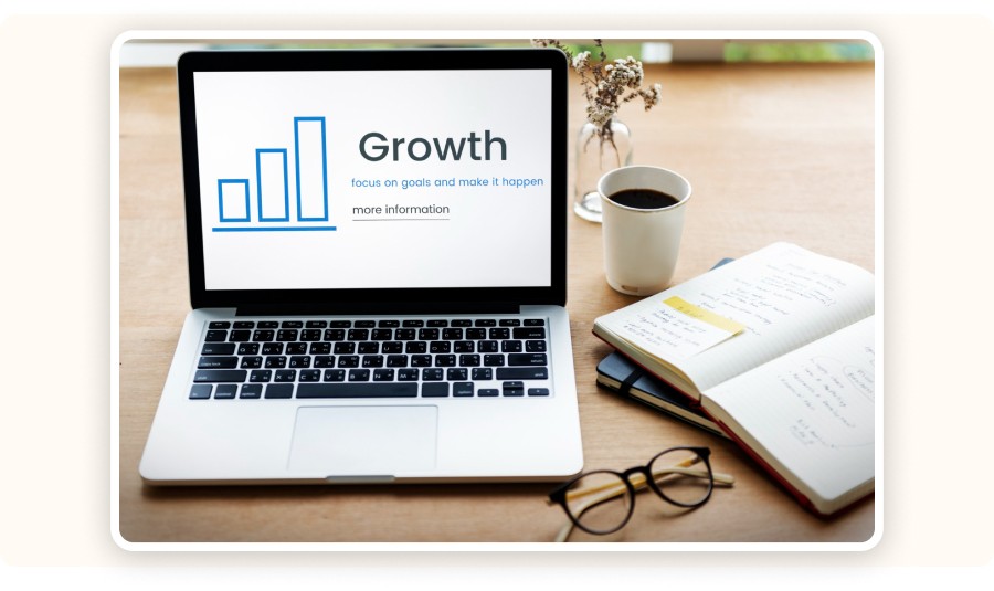 Laptop displaying the word “Growth”