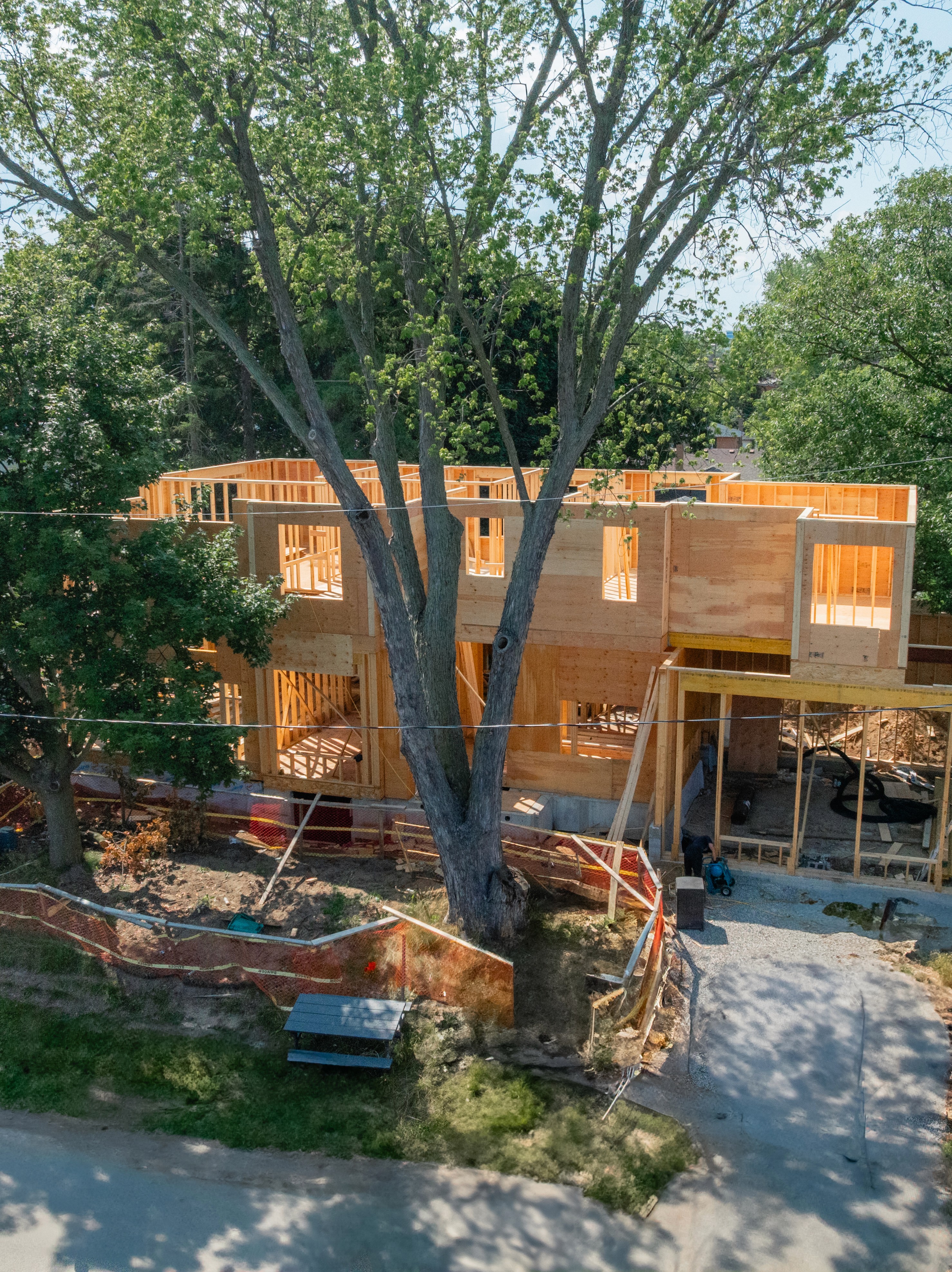 Modern luxury home with stone accents at sunset.