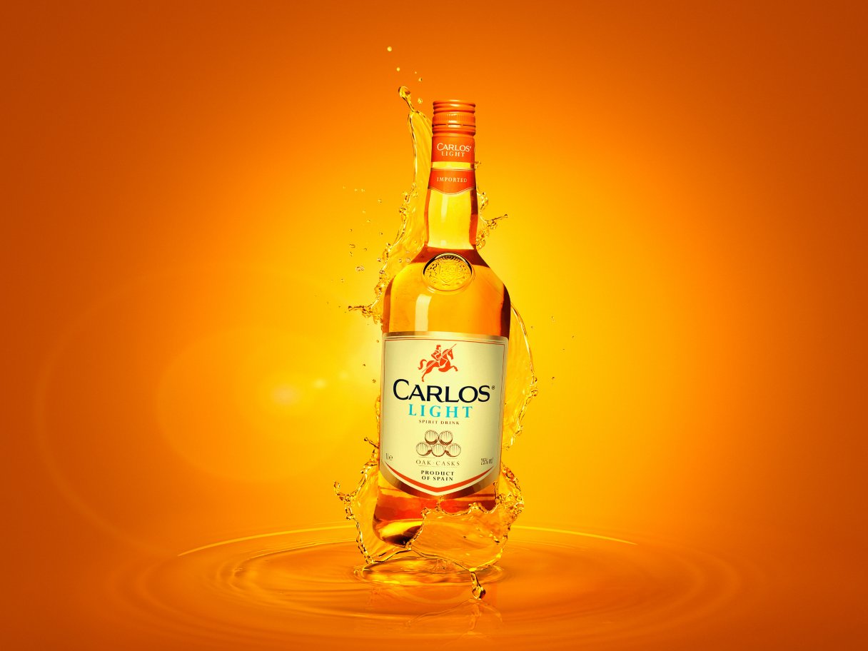 Rustic cabin in a golden field at sunset