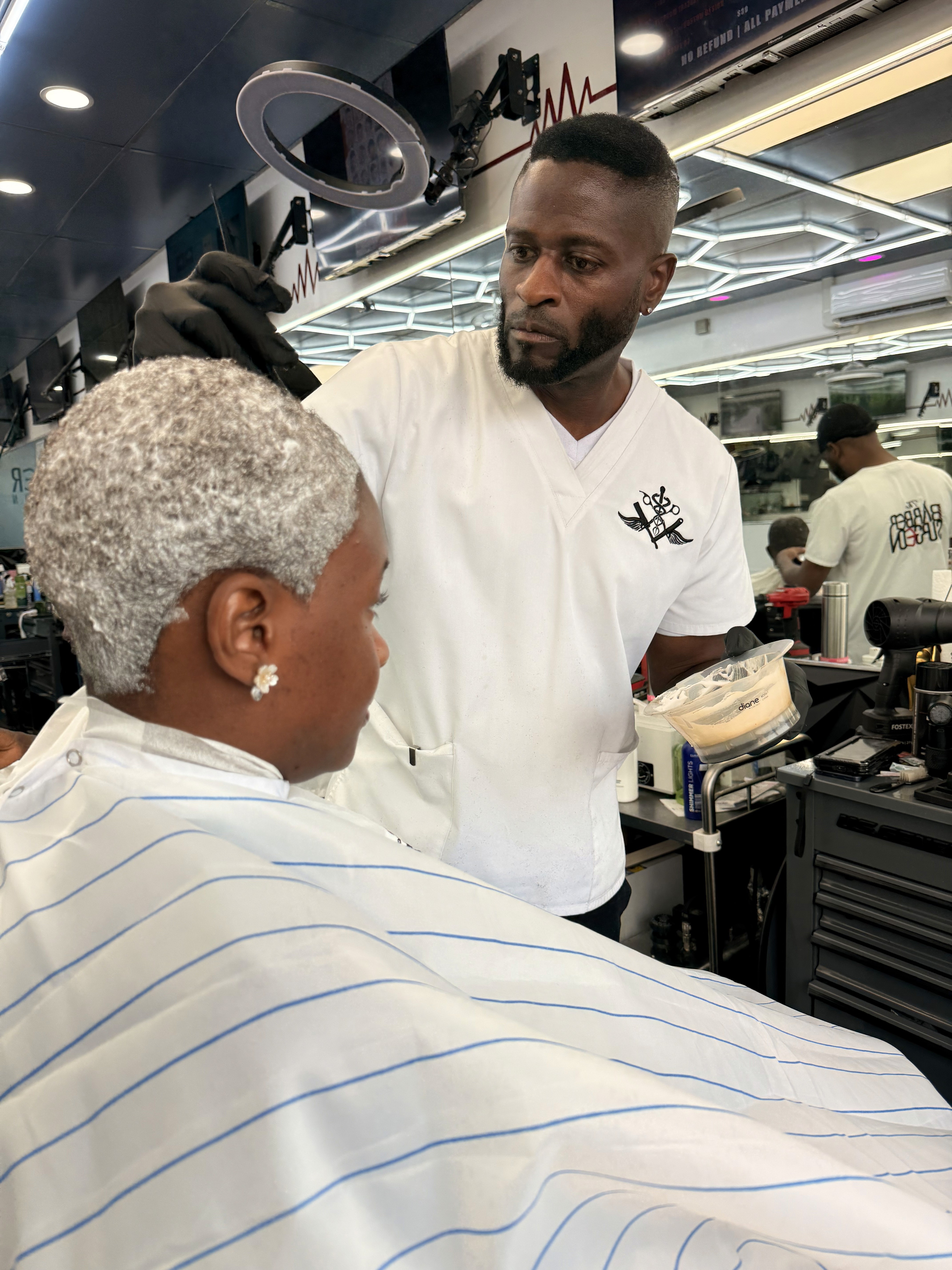 Barber attending client
