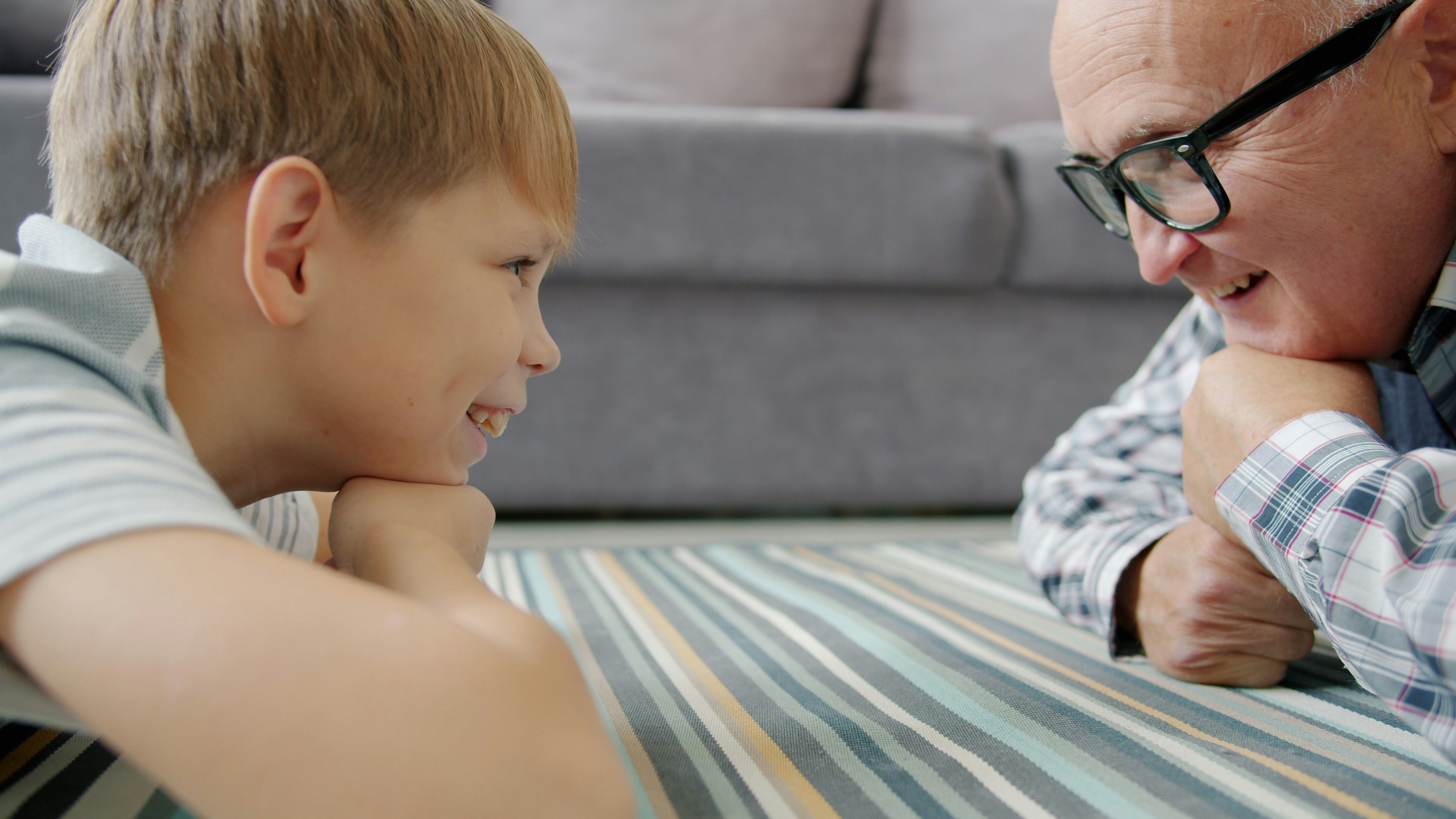 Grandfather and grandson looking at each other