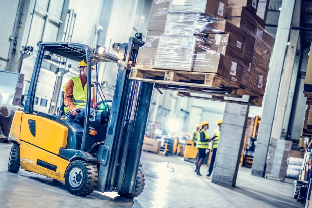 Image of a forklift lifting up a pallet of goods