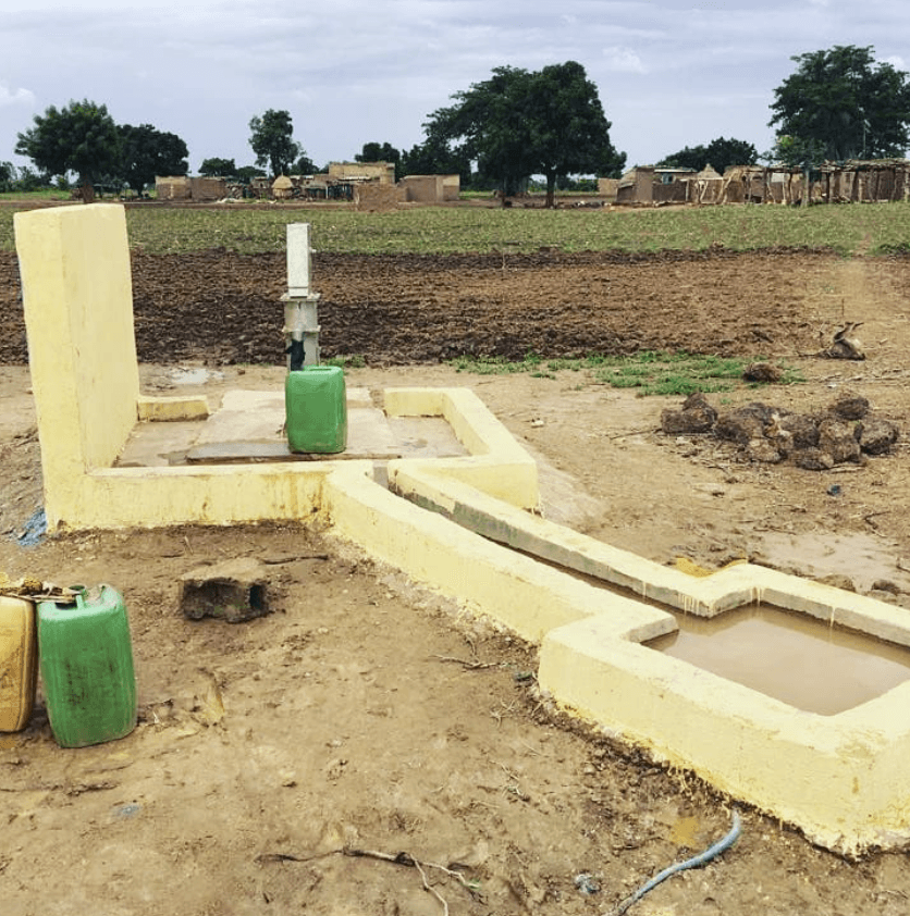 woman in brown sleeveless dress lying on bed